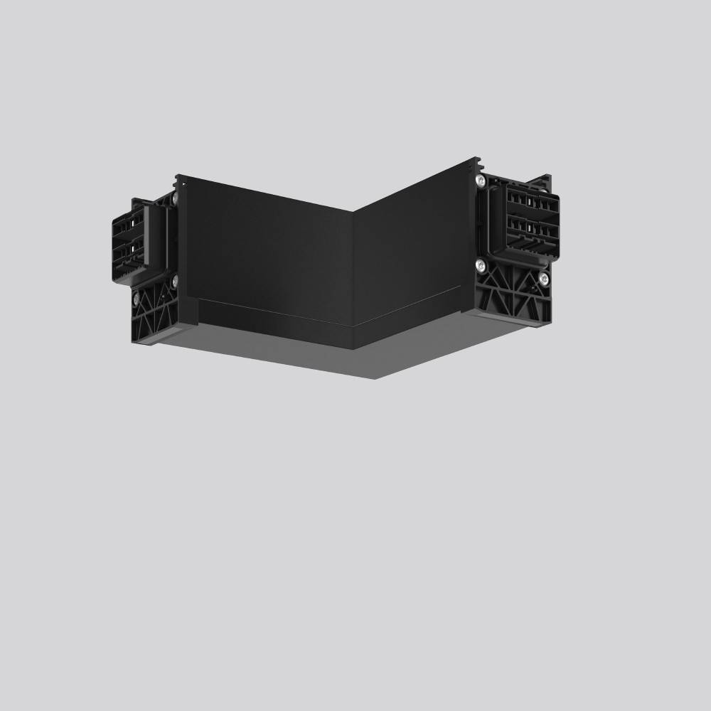 Eine schwarze, L-förmige elektronische Komponente mit Anschlüssen an jedem Ende vor einem grauen Hintergrund.