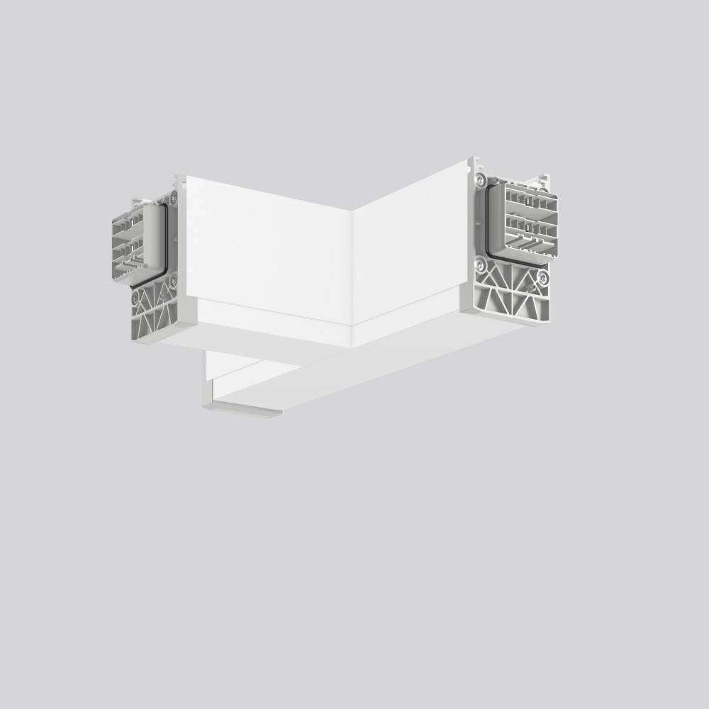 Eine L-förmige weiße Metallhalterung mit strukturierten Details, wahrscheinlich zur strukturellen Unterstützung oder zum Verbinden zweier Oberflächen verwendet, auf einem hellgrauen Hintergrund abgebildet.