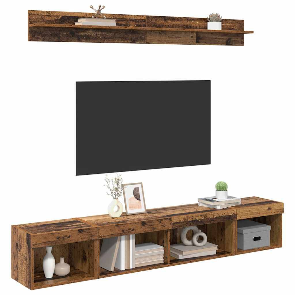 Eine Holz-Entertainment-Einheit mit einem schwebenden Regal darüber. Die Einheit verfügt über Regale und dekorative Gegenstände, mit einem Platz für einen großen Fernseher dazwischen.