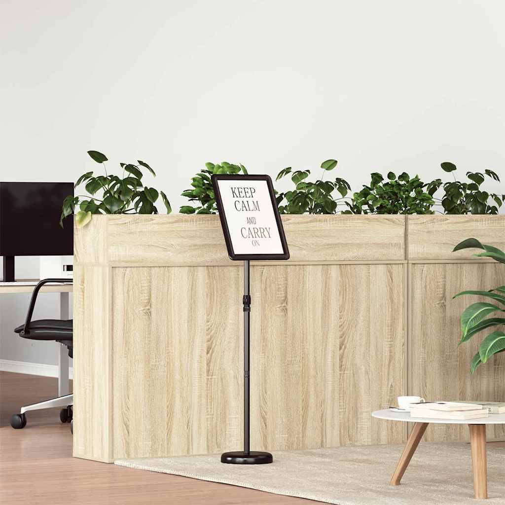 Eine Büroumgebung mit einem hellen Holz-Empfangstresen, auf dem ein Schild mit der Aufschrift 