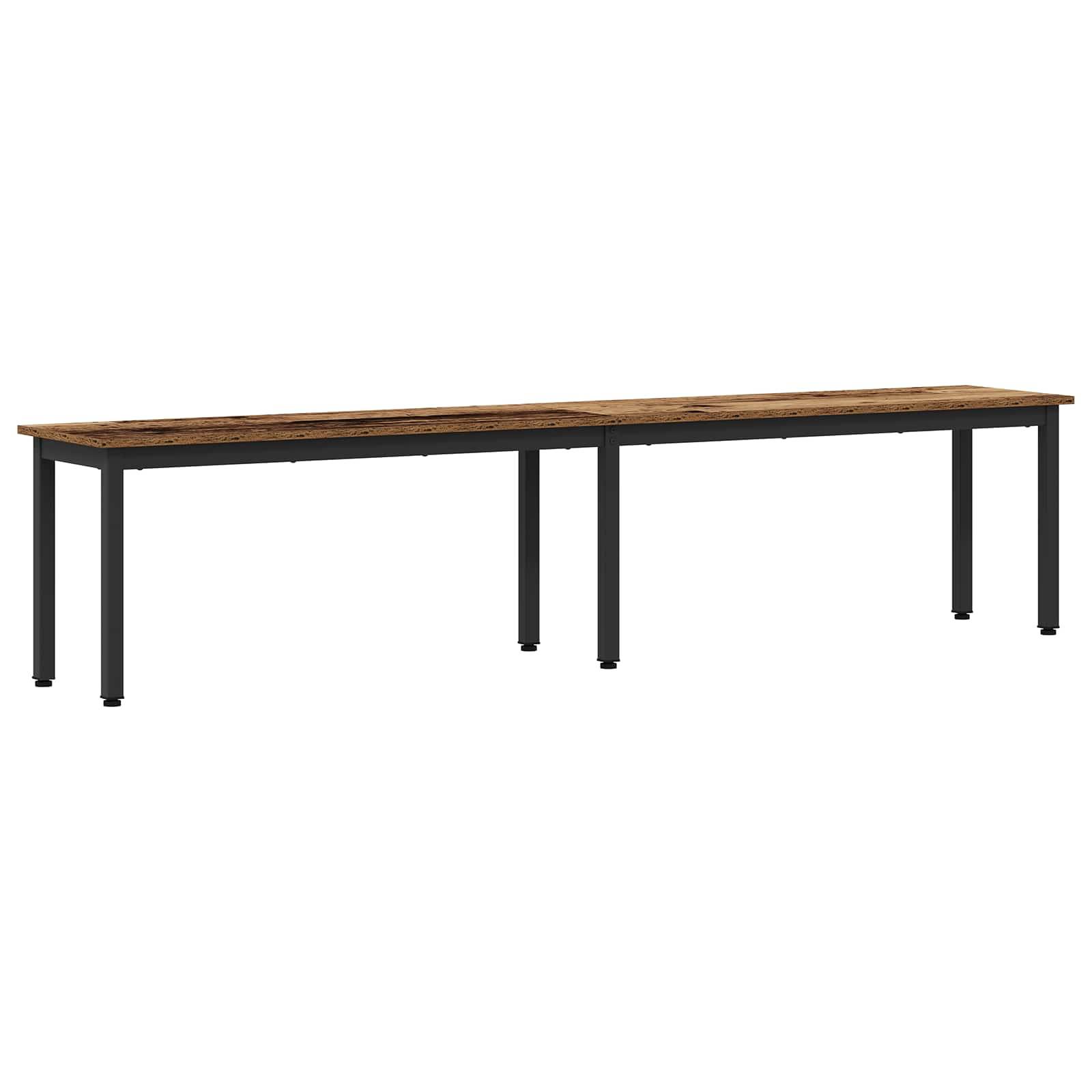 Ein langer rechteckiger Holztisch mit schwarzen Metallbeinen.