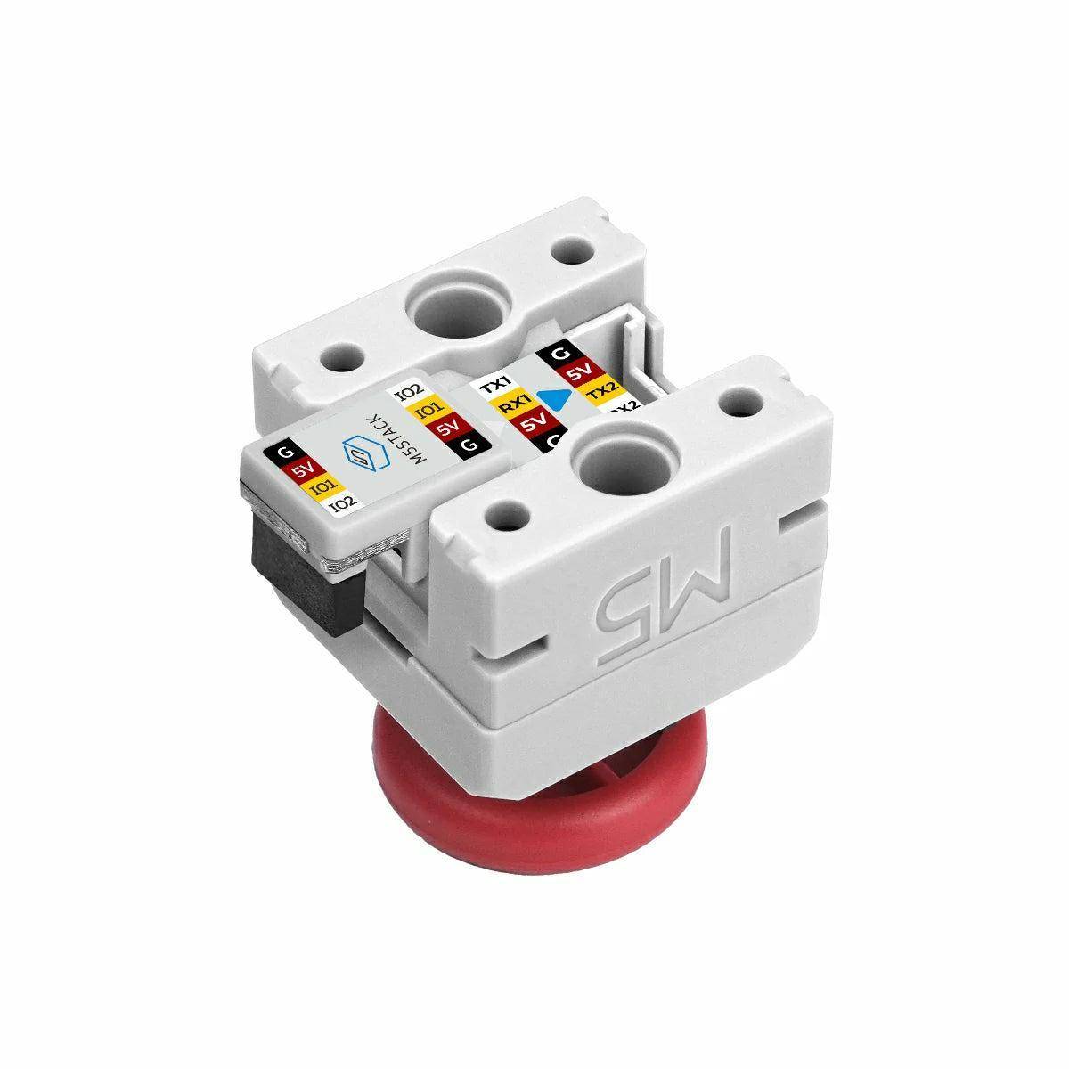Eine weiße Ingenieurkomponente mit roter Basis und beschrifteten Anschlüssen, verwendet für elektrische Verbindungen.