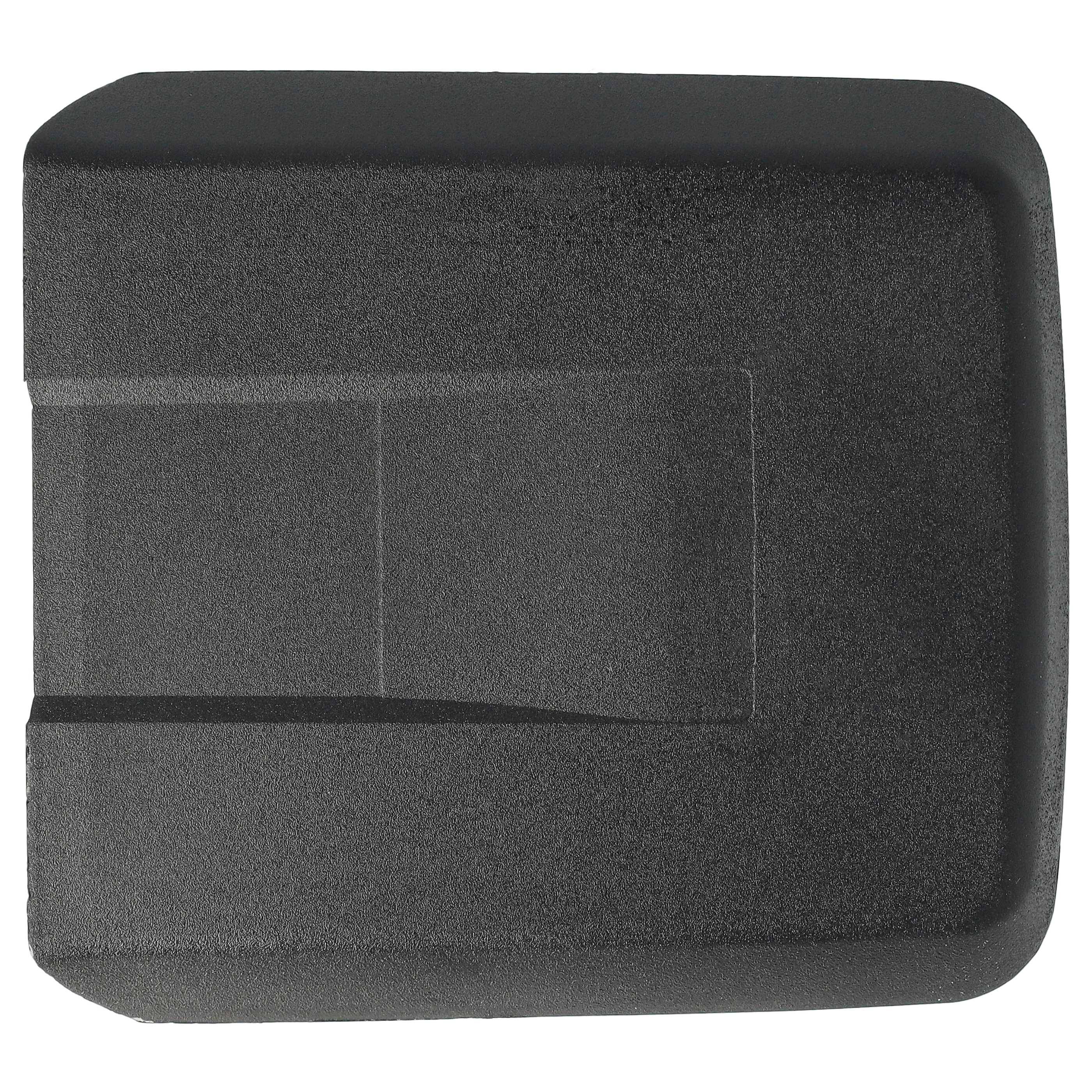 Ein schwarzer Schaumstoffblock in rechteckiger Form mit einem zentralen, versetzt angeordneten horizontalen Schlitz, möglicherweise Teil einer Verpackung oder eines Halters zum Sichern von Gegenständen.