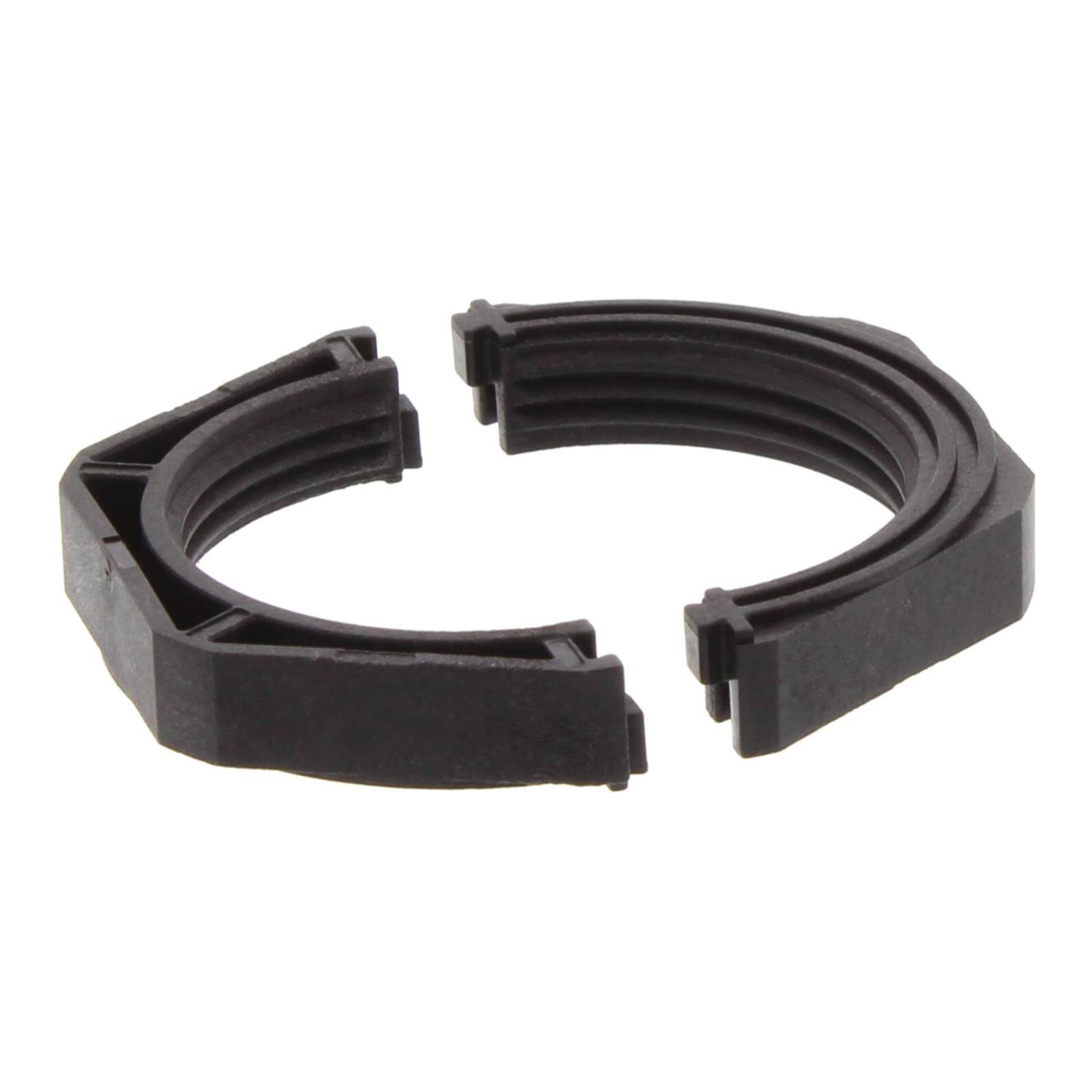 Ein Nahaufnahmefoto einer schwarzen, halbkreisförmigen Kunststoffkomponente mit gerillten Kanten.