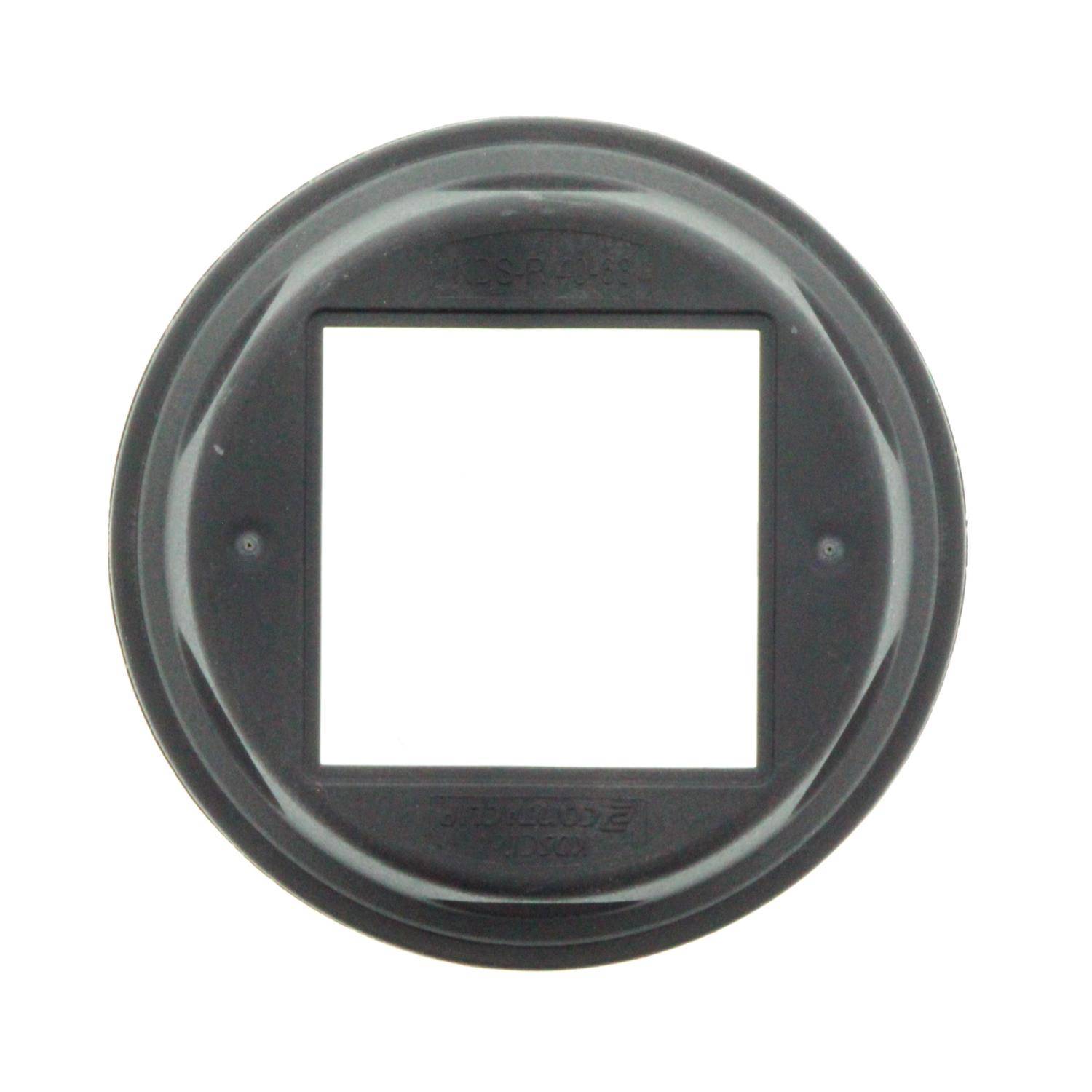 Ein runder, grauer Kunststoffrahmen mit einer quadratischen Öffnung in der Mitte, höchstwahrscheinlich ein Diapositiv-Halter für einen Projektor.