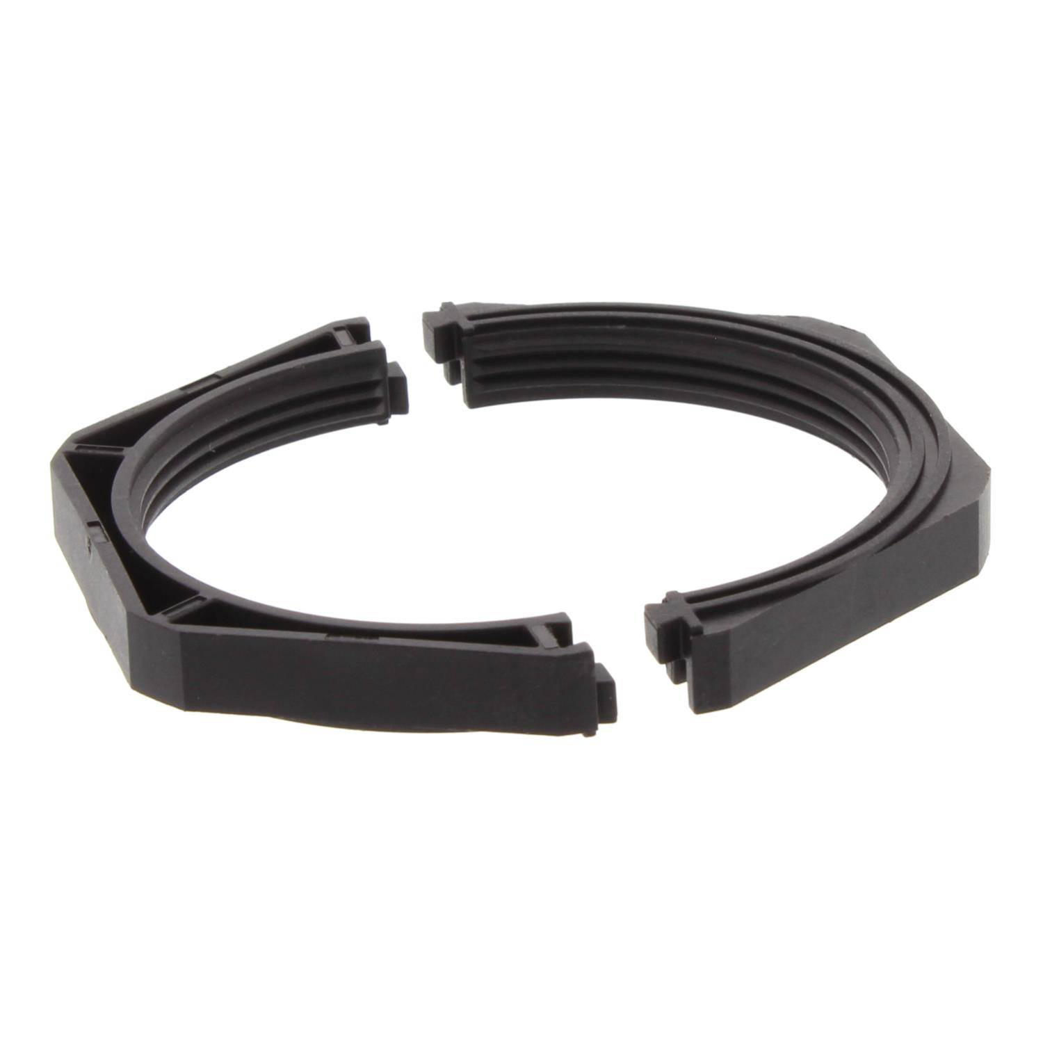 Ein schwarzer, kreisförmiger, ringförmiger Kunststoffgegenstand mit Einbuchtungen und Anschlüssen, möglicherweise eine Komponente für Montage oder Reparatur.