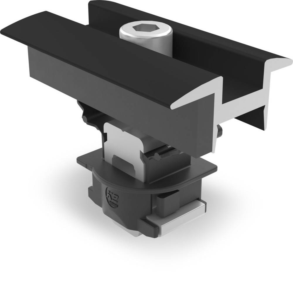 Eine Nahaufnahme einer mechanischen oder industriellen Komponente, die einen schwarz-silbernen zylindrischen Teil mit ineinandergreifenden Elementen zeigt, der möglicherweise für Montage oder Maschinenbau verwendet wird.