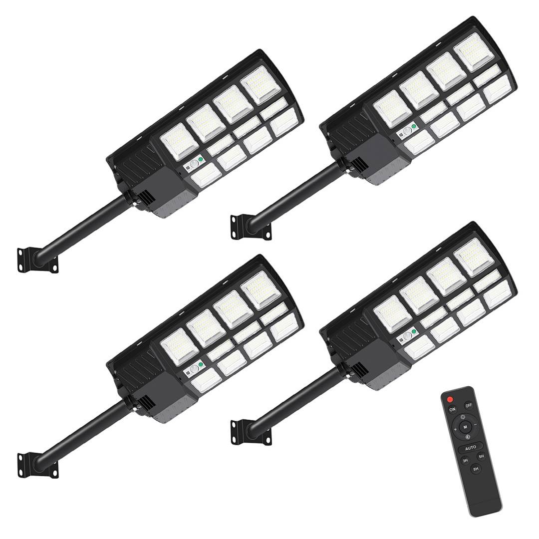 Vier Solarstraßenlampen, die auf Halterungen montiert sind, mit einer Fernbedienung, die daneben liegt.