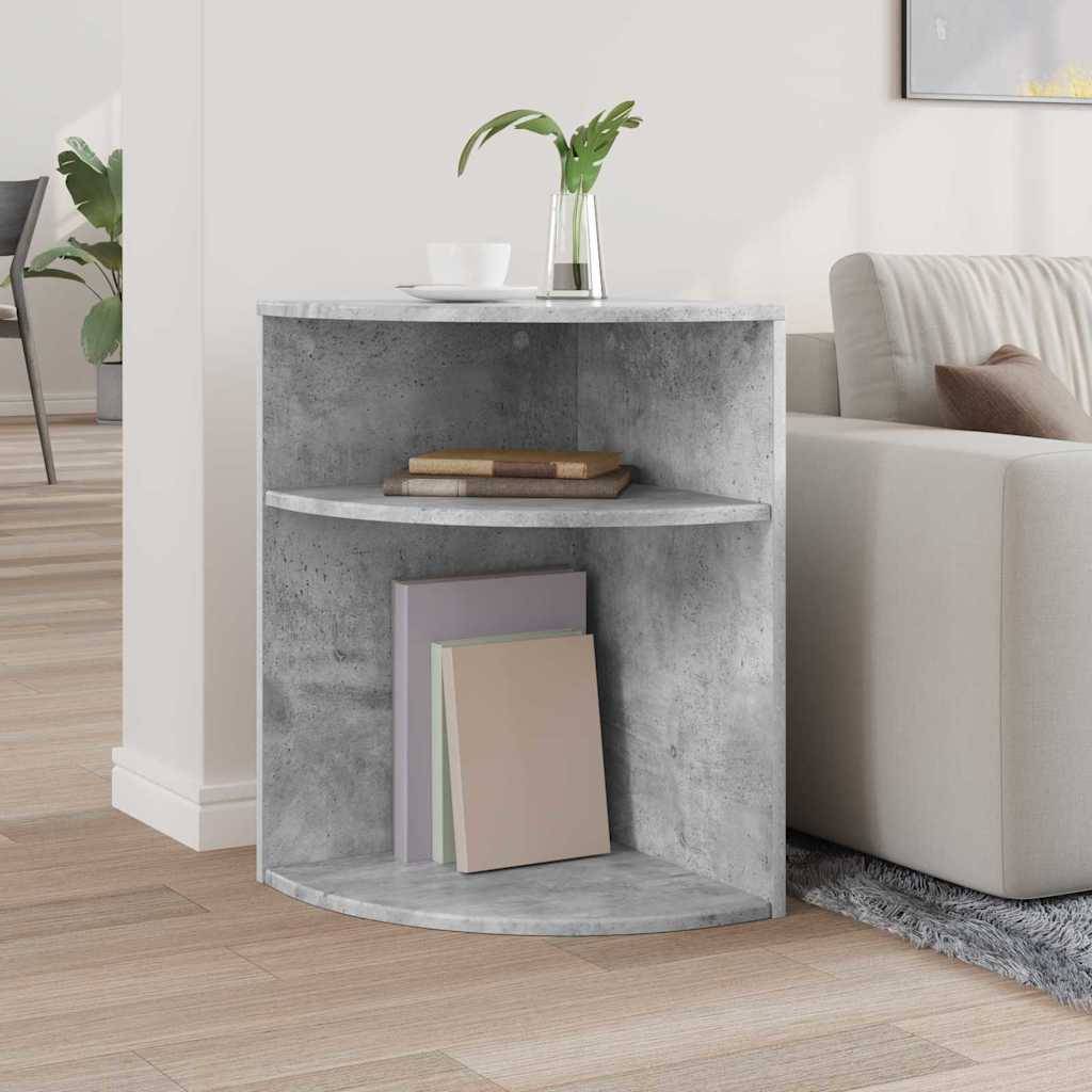 Ein kleines, rundes Eckbücherregal mit grauer Betonoptik, das zwei Bücher auf dem mittleren Regal trägt und mit einer Vase auf der Oberseite dekoriert ist.