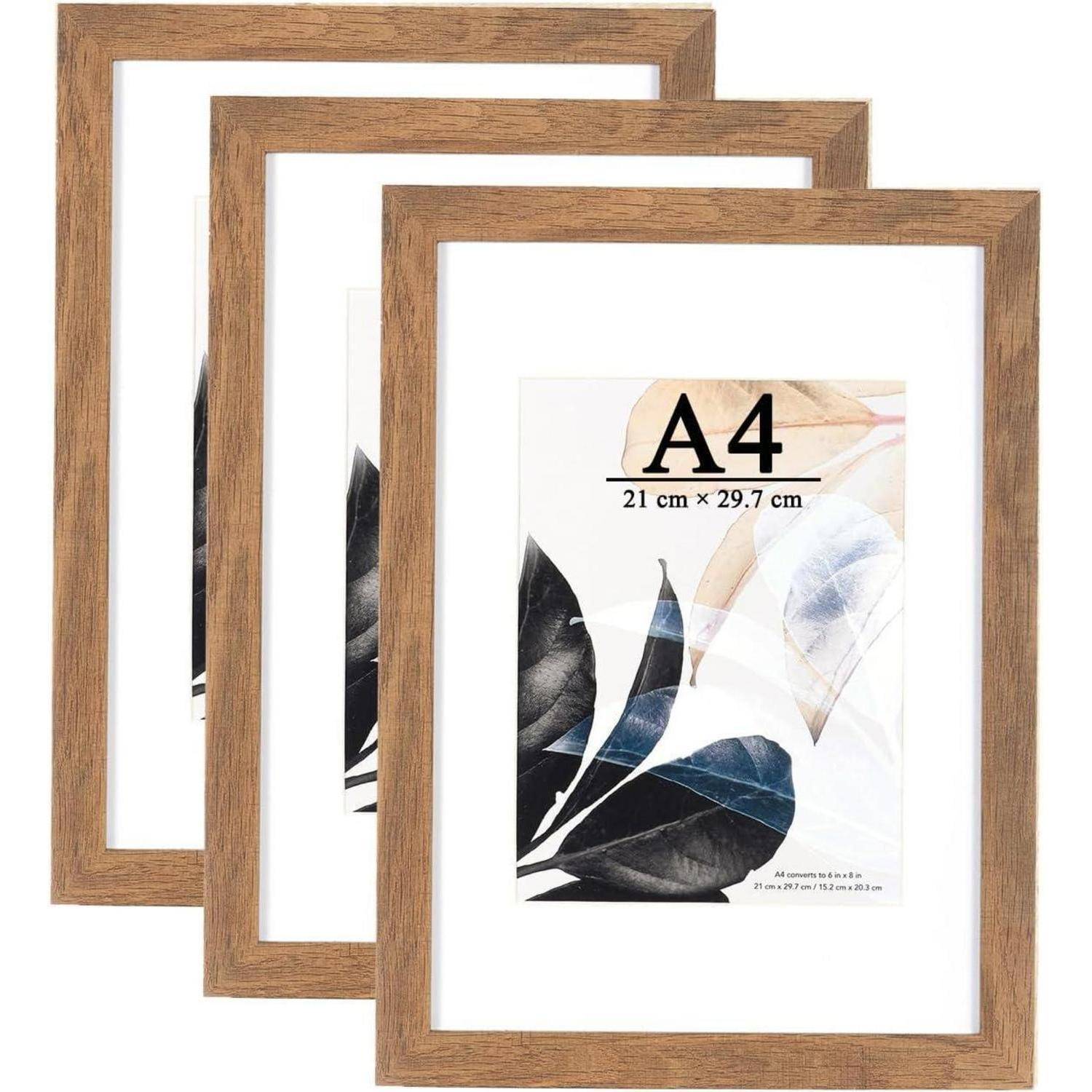 Set aus drei Holz-Bilderrahmen, jeder mit dekorativen Blättern verziert und mit 'A4 21 cm × 29,7 cm' beschriftet, geeignet zum Aufhängen an der Wand.