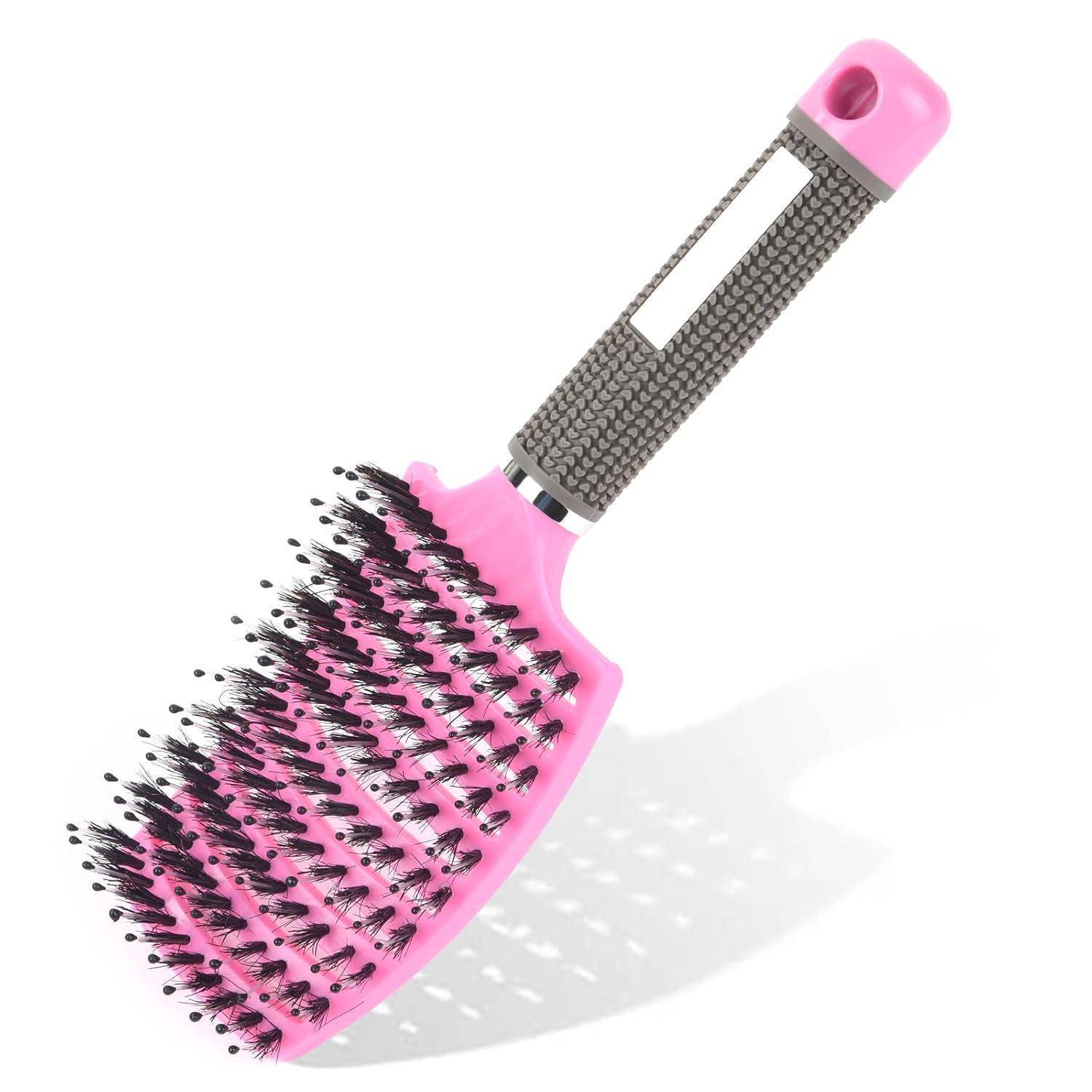 Eine pinke Haarbürste mit schwarzen Borsten und einem strukturierten grauen Griff mit einem Loch am Ende.