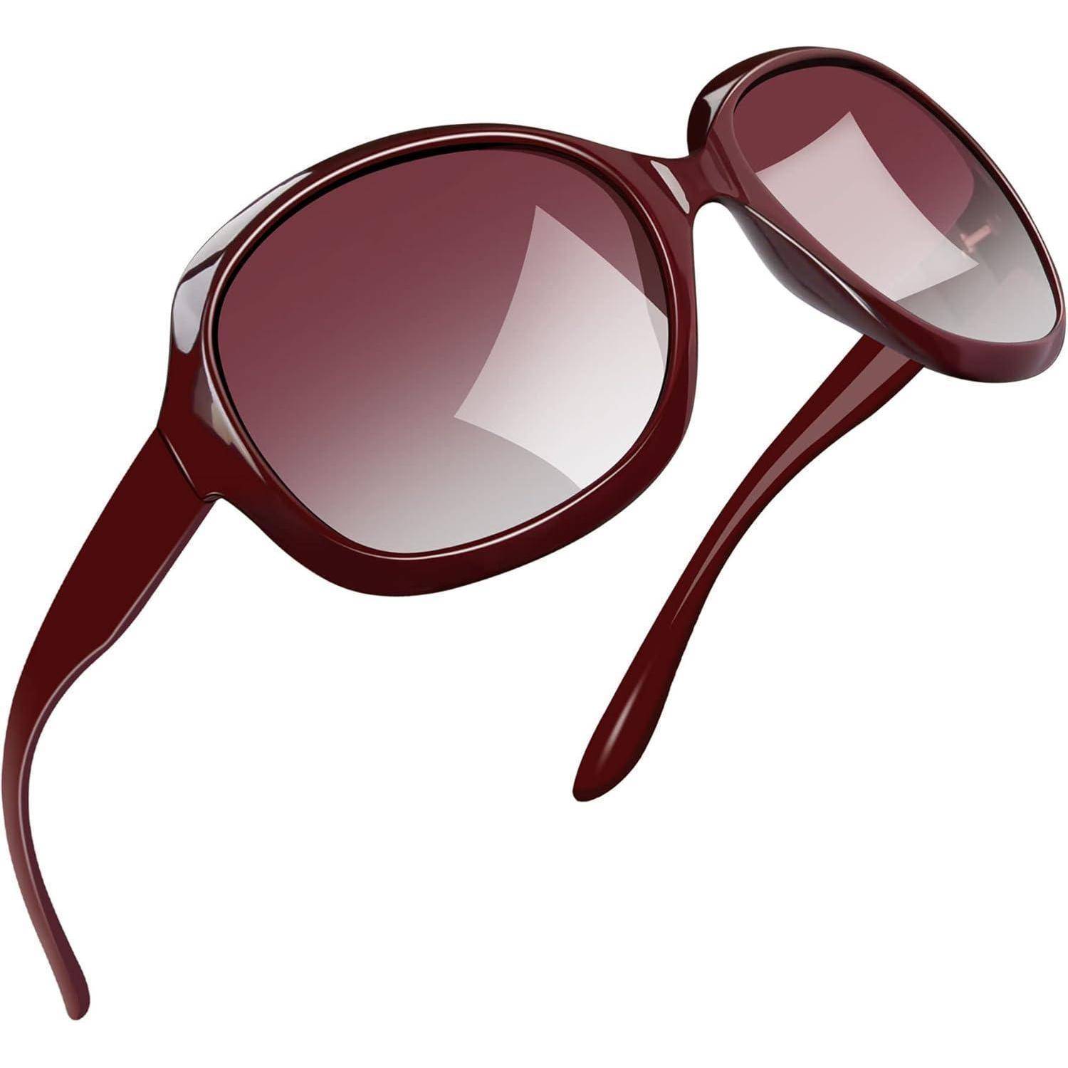 Eine Sonnenbrille in elegantem Rot mit ovalen Gläsern und Verlaufstönung, ausgestattet mit einem geschwungenen Rahmen und glatter, glänzender Oberfläche.