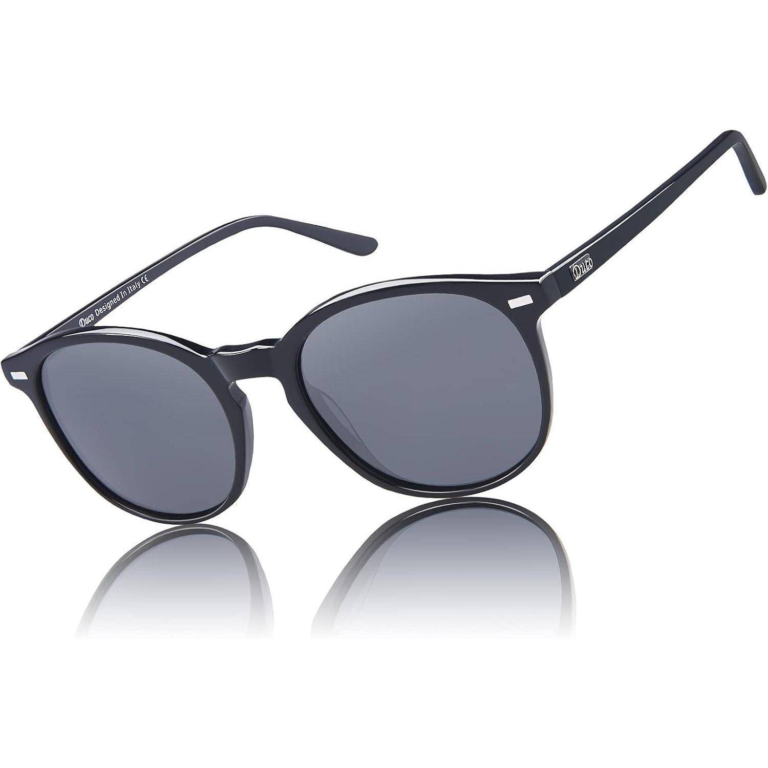 Schwarze ovale Sonnenbrille mit getönten Gläsern und dünnen Rahmen, präsentiert vor einem weißen Hintergrund.