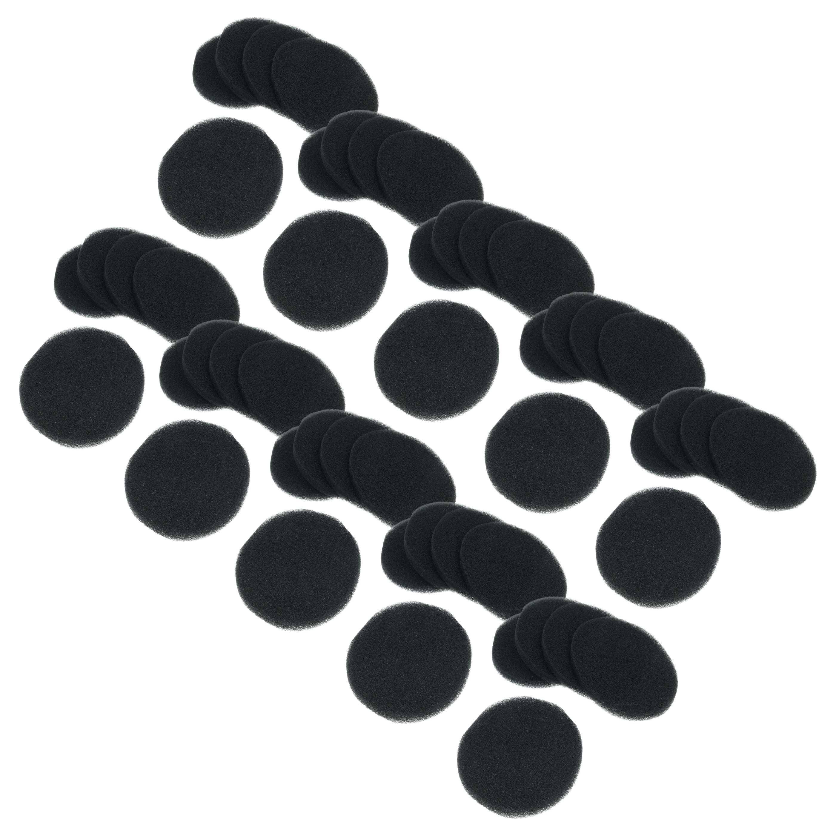 Mehrere schwarze Schaumstoff-Windschutzschilde für Mikrofone sind auf weißem Hintergrund angeordnet und variieren in Menge und Platzierung.