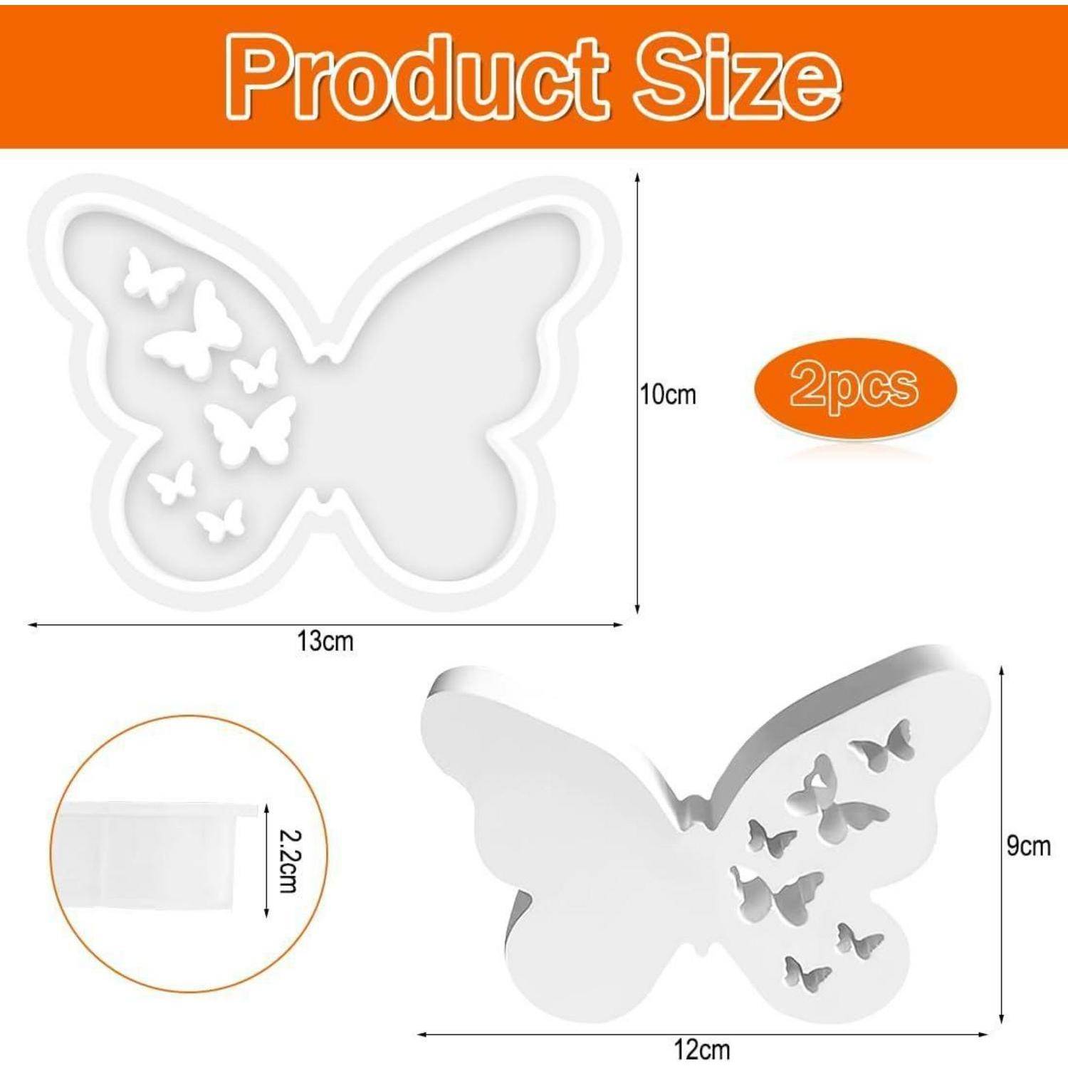 Produktgröße': Weißes schmetterlingsförmiges Objekt, 13 cm breit, 10 cm hoch. Umfasst zwei Teile mit kleinen Schmetterlings-Ausschnitten und Klebepads.