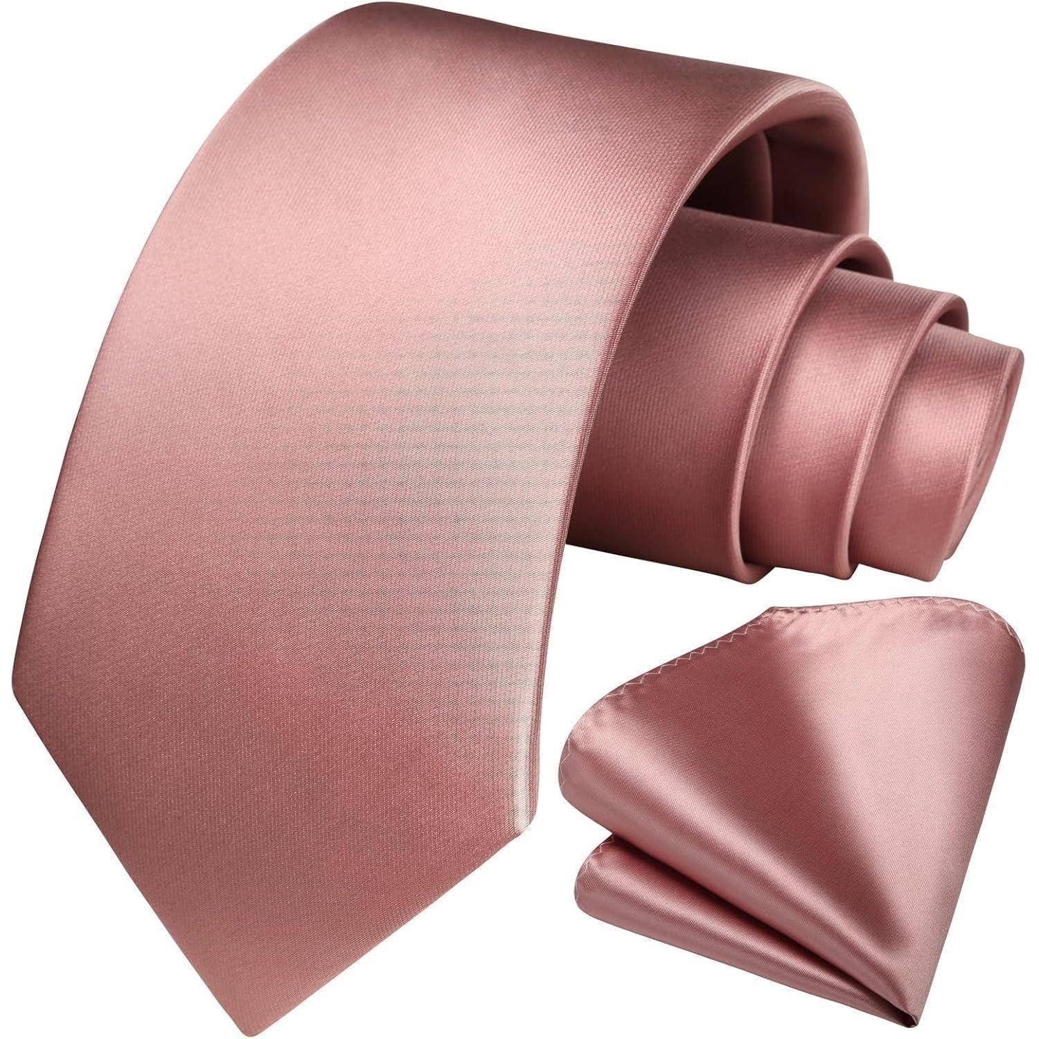 Eine pinke Seidenkrawatte mit passendem Einstecktuch, elegant vor einem schlichten Hintergrund drapiert und ein formelles Accessoire-Set präsentierend.