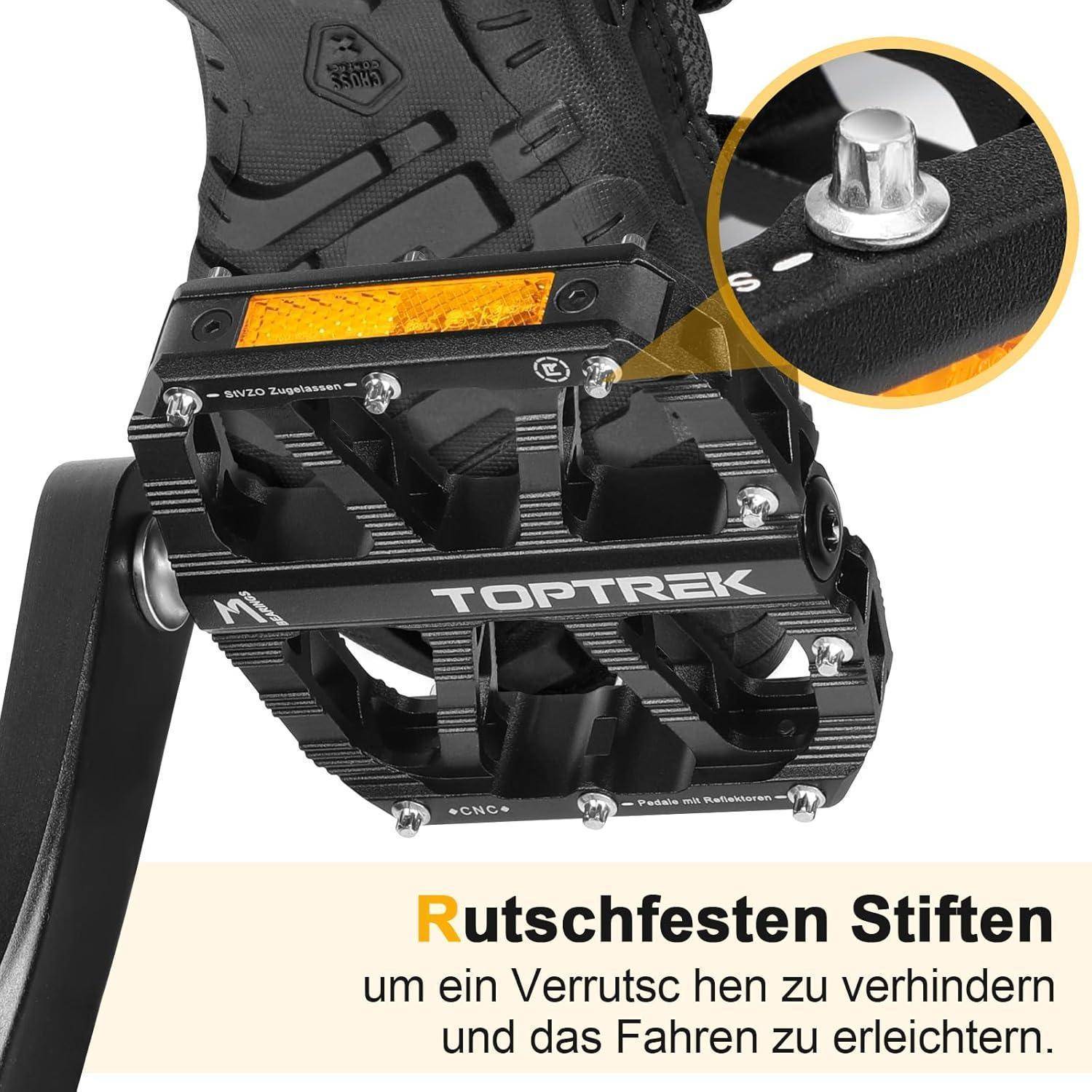 TOPTREK Schwarzer Fahrradpedal mit orangefarbenen Reflektoren und rutschfesten Stiften erklärt: 'Rutschfeste Stifte, um ein Verrutschen zu verhindern und das Fahren zu erleichtern.