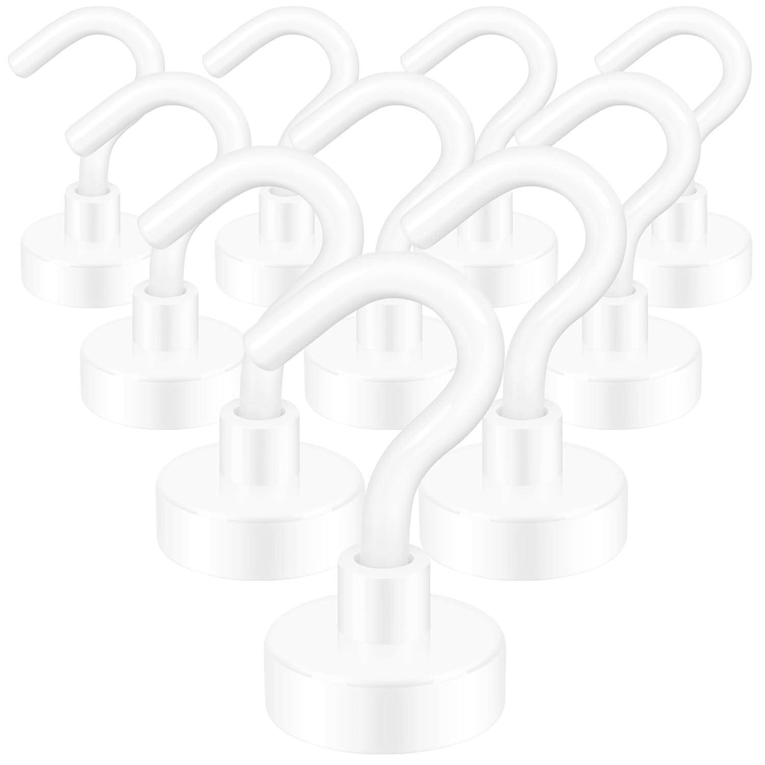 Satz von weißen Magnethaken mit geschwungener Gestaltung, geeignet für Organisation und Aufbewahrung.
