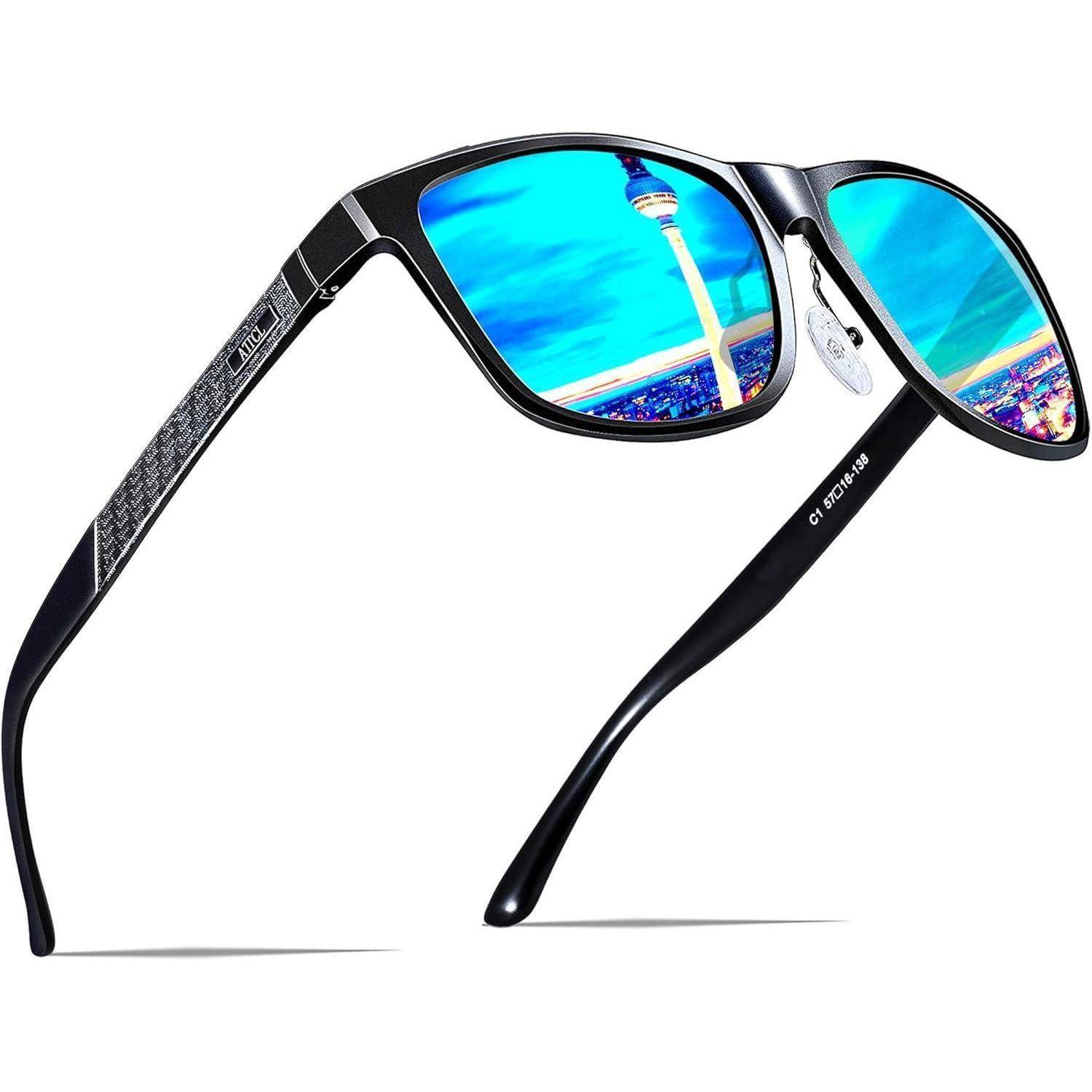 Sonnenbrille mit schwarzen Rahmen und blau getönten Gläsern, die eine Stadtlandschaft mit einem Turm vor einem weißen Hintergrund reflektieren.