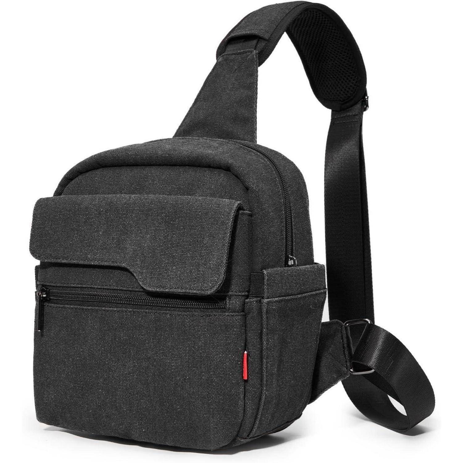 Eine schwarze Umhängetasche mit elegantem Design, ausgestattet mit zwei Reißverschlusskompartimenten und einem verstellbaren Trageriemen.