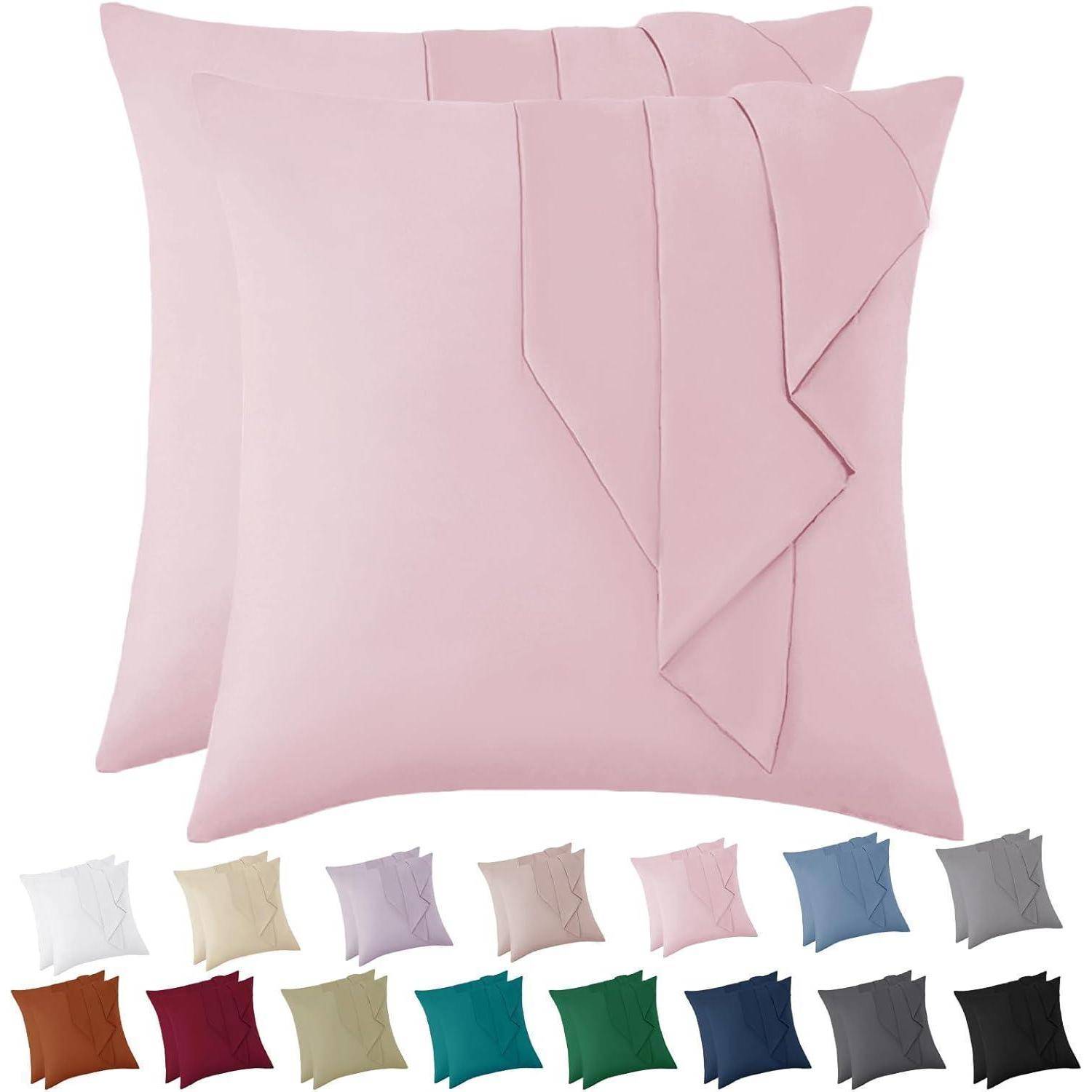 Zwei rosa Zierkissen mit plissierten Designs, dargestellt mit 16 Farbvariationen darunter, einschließlich Beige, Petrol und Marineblau.