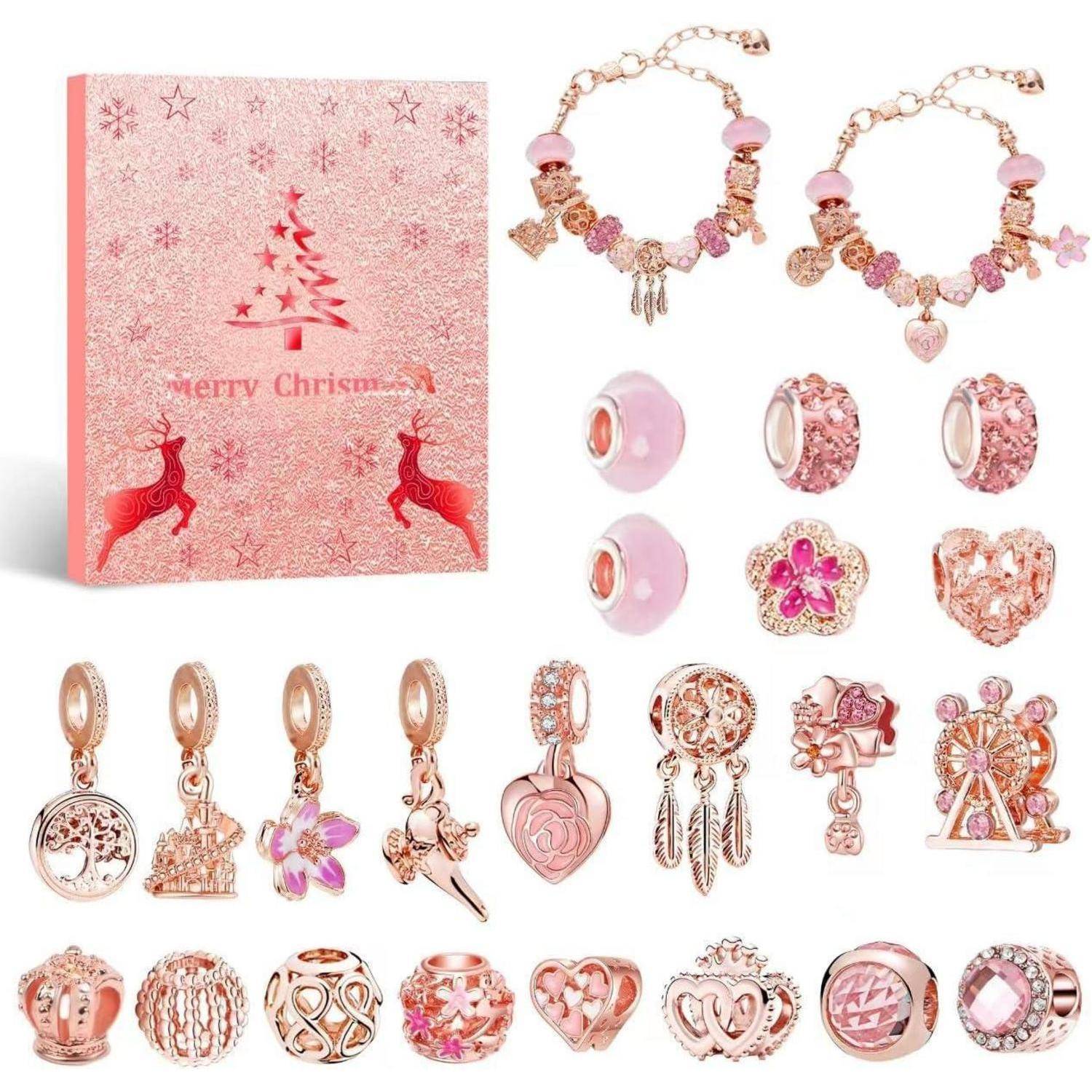 Ein Schmuckset in Rosa mit verschiedenen Anhängern und Perlen, begleitet von einer dekorativen Schatulle mit einem Weihnachtsbaum und Rentieren.