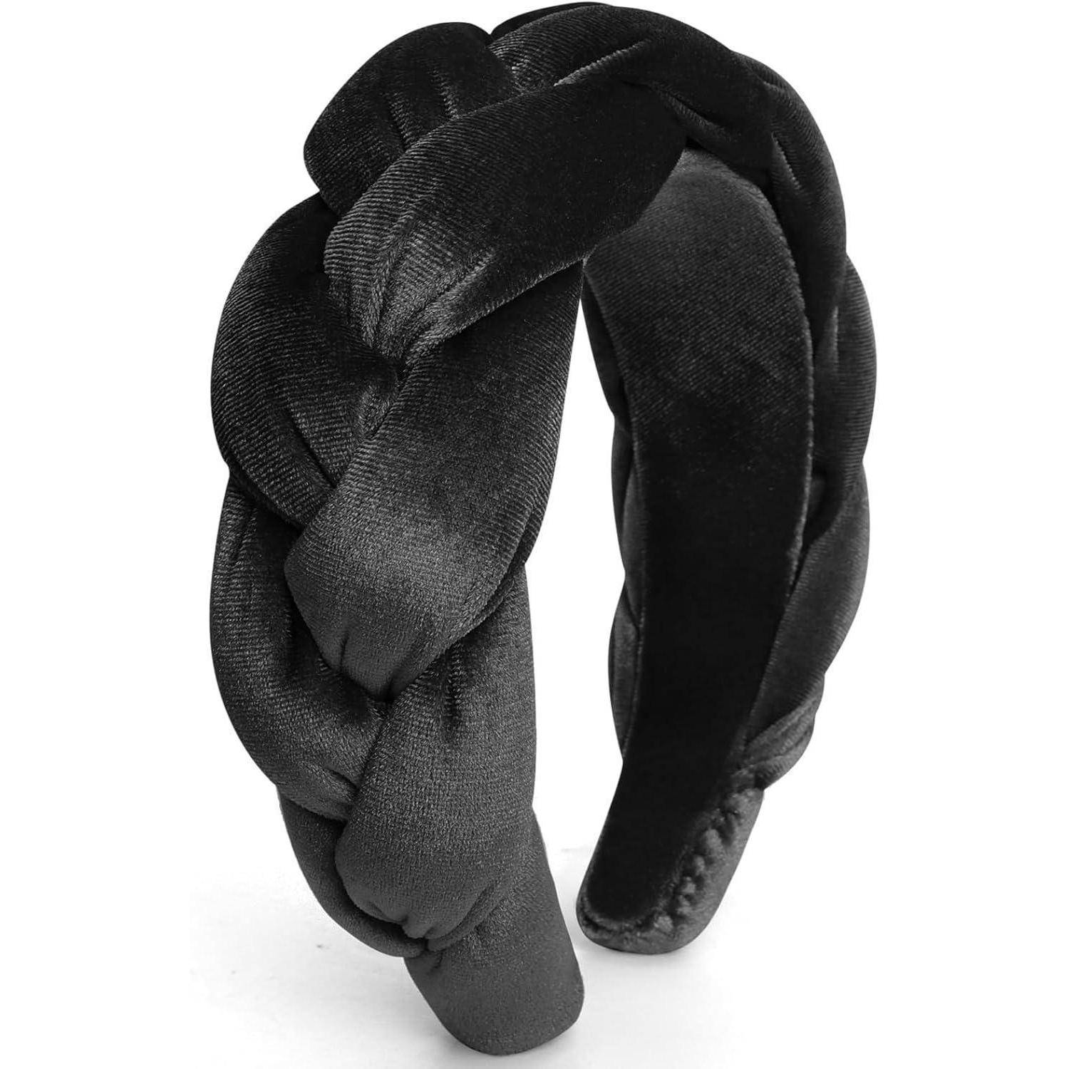 Ein schwarzes, geflochtenes Haarband aus Samtstoff, das in einer gebogenen Form gearbeitet ist, um sich der typischen Kopfform anzupassen.