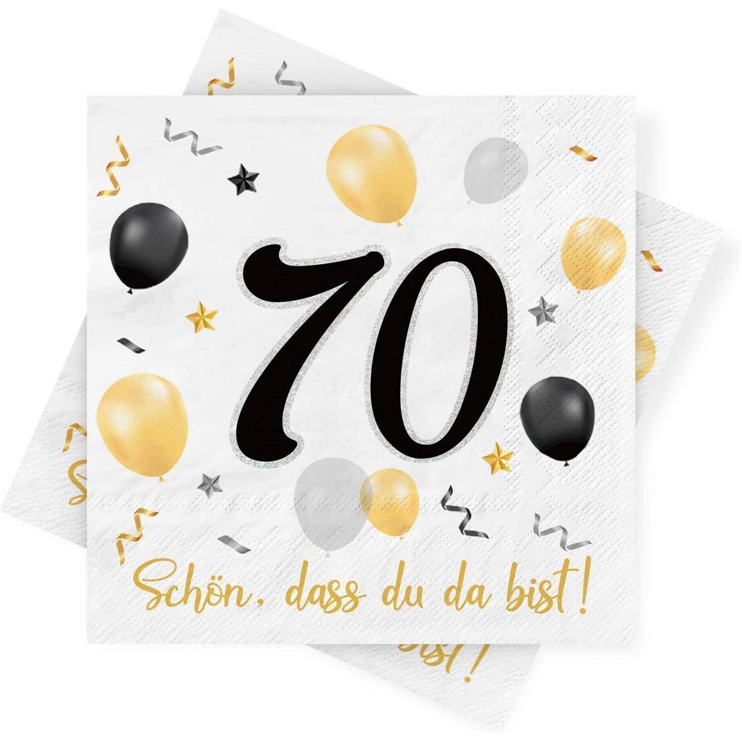 Ein Serviette ist mit goldenen und schwarzen Luftballons und Sternen zum 70. dekoriert. Der deutsche Text lautet 'Schön, dass du da bist!'.