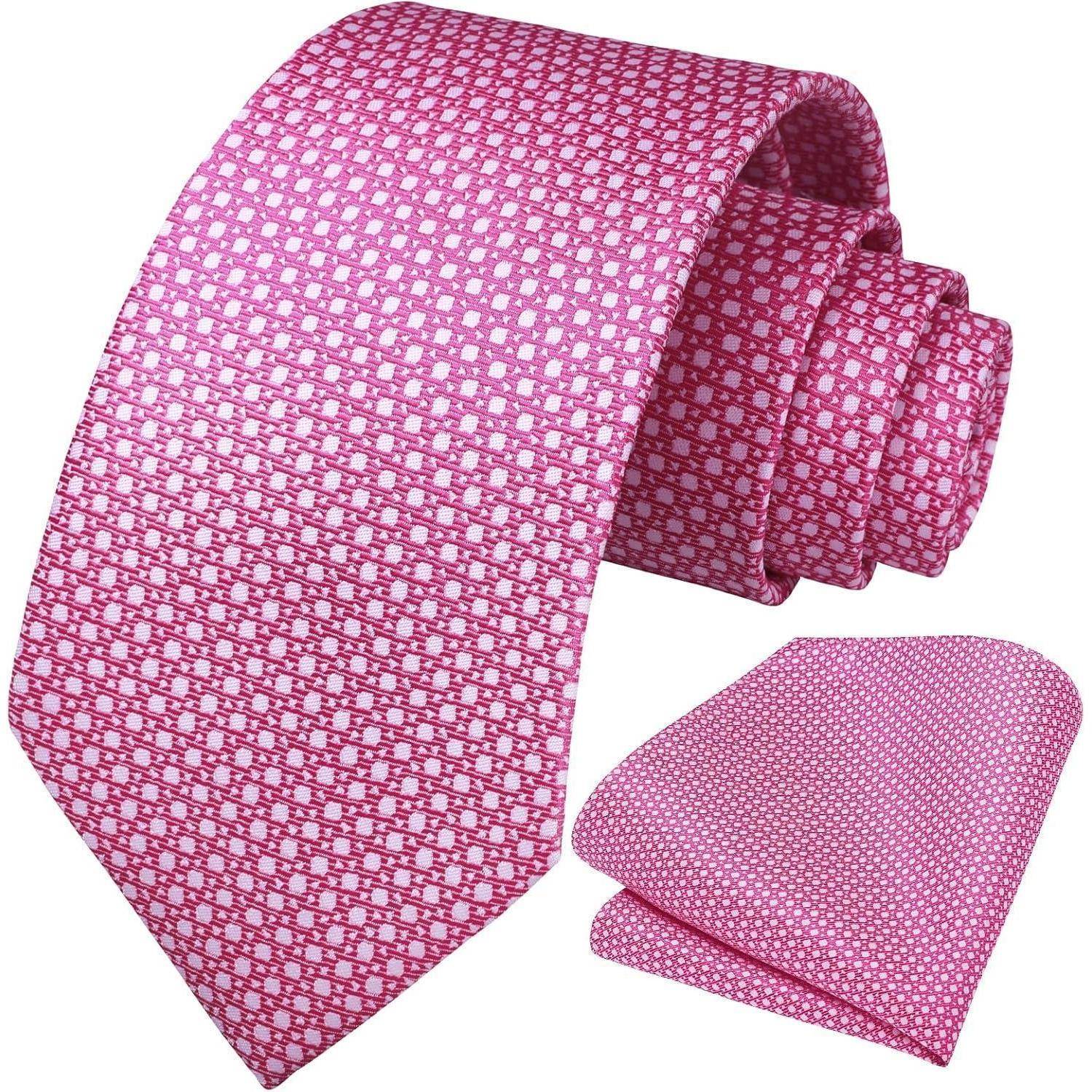 Ein Krawattenset in Rosa mit einem kleinen weißen geometrischen Muster, bestehend aus Krawatte und Einstecktuch.