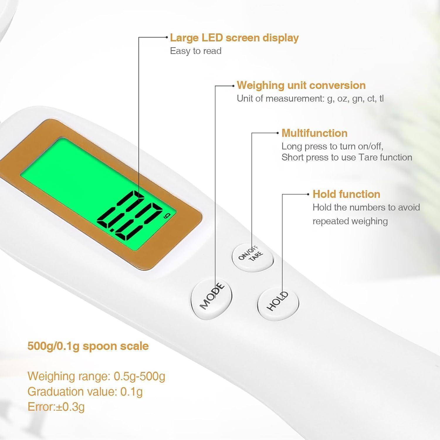 Digitale Waage mit grüner LED-Anzeige, die '0,0' zeigt. Beschriftungen weisen auf Funktionen hin: Einheitsumwandlung, Multifunktionstaster, Haltefunktion. Wägkapazität: 500g/0,1g Genauigkeit.