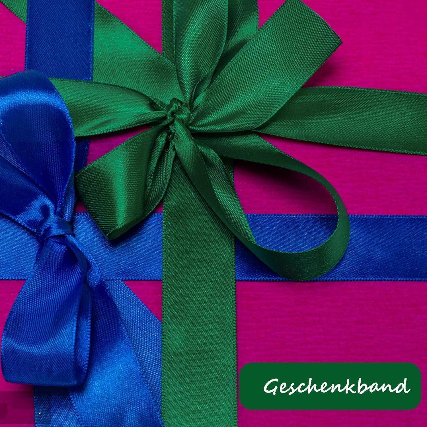Ein Geschenk, eingewickelt in pinkes Papier mit grünen und blauen Bändern, die zu Schleifen gebunden sind. Das Wort 'Geschenkband' wird in der unteren rechten Ecke angezeigt.