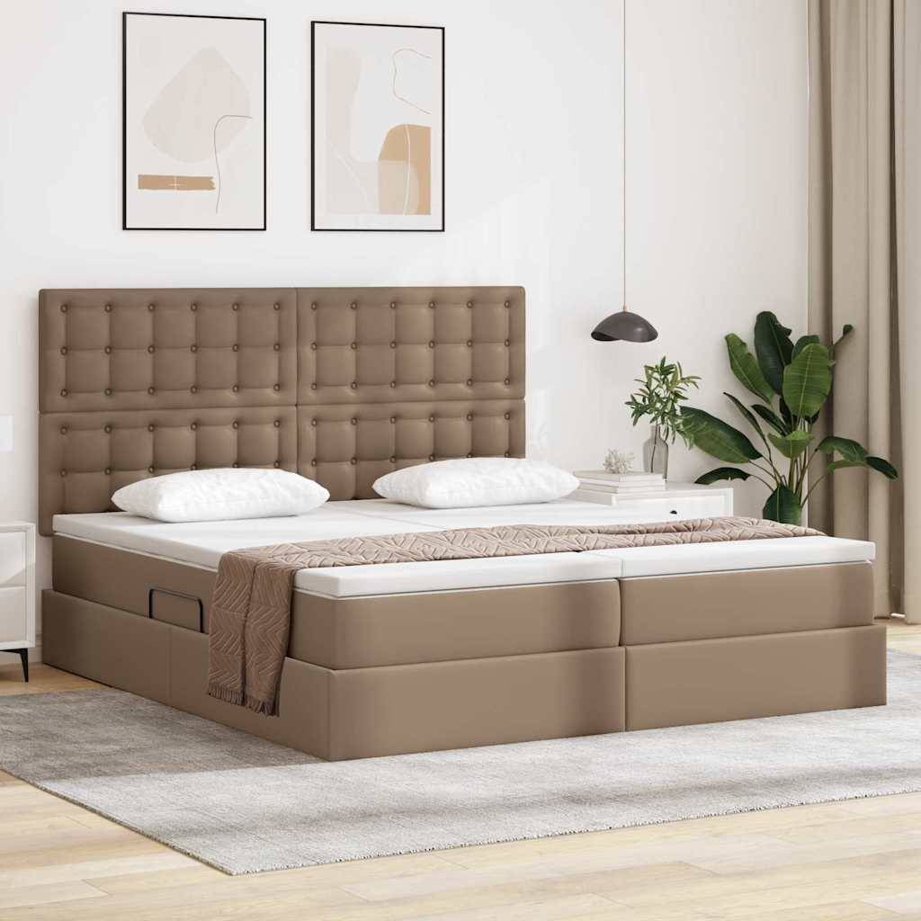 Ein modernes Schlafzimmer mit einem beigen Polsterbett, weißer Bettwäsche, zwei abstrakten Gemälden an der Wand, einer Pendelleuchte und einer Pflanze.