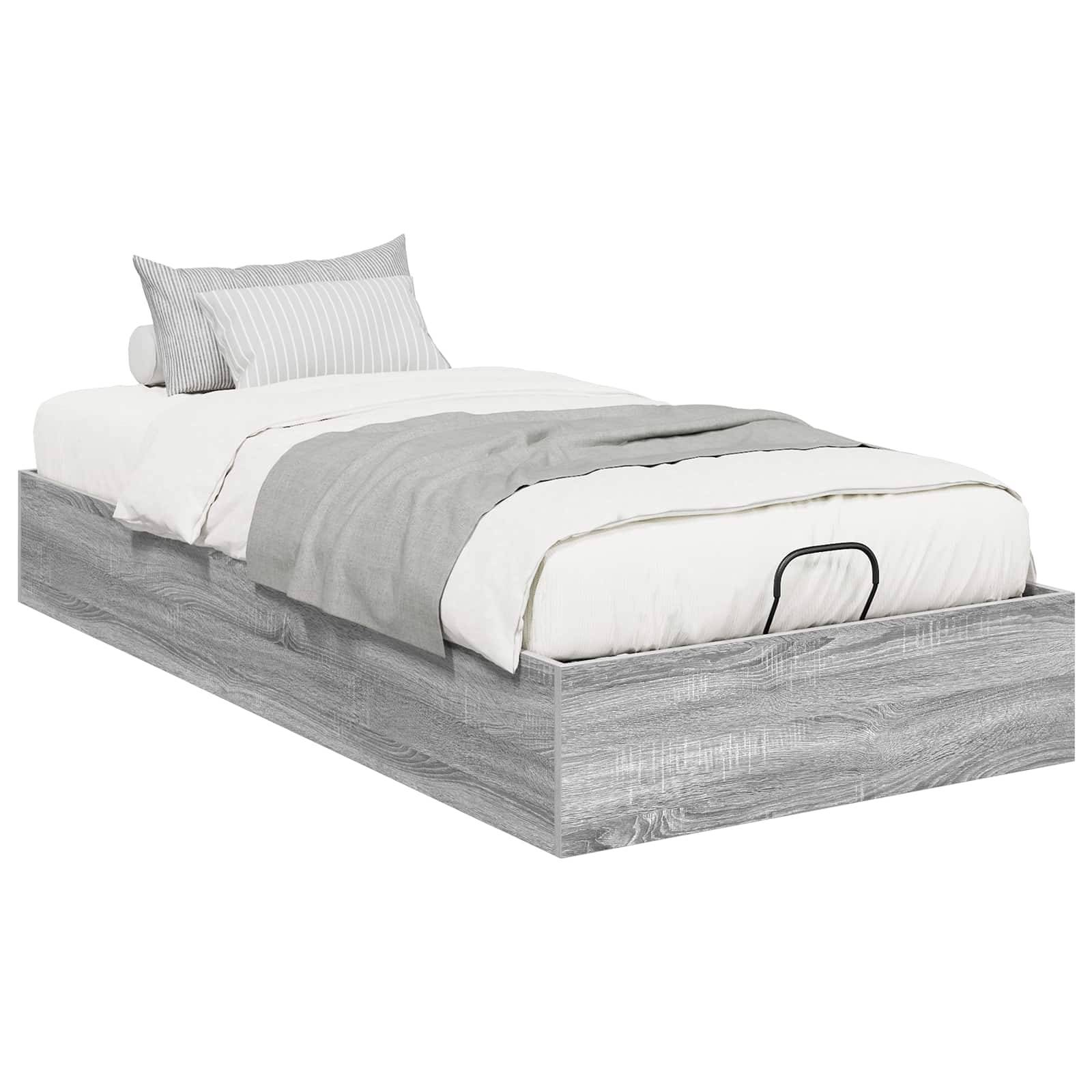 Ein Bettgestell mit hellem Holzfinish, ausgestattet mit einem weiß-grauen Bettwäscheset, bestehend aus Kissen und einer gefalteten Steppdecke am Fußende.