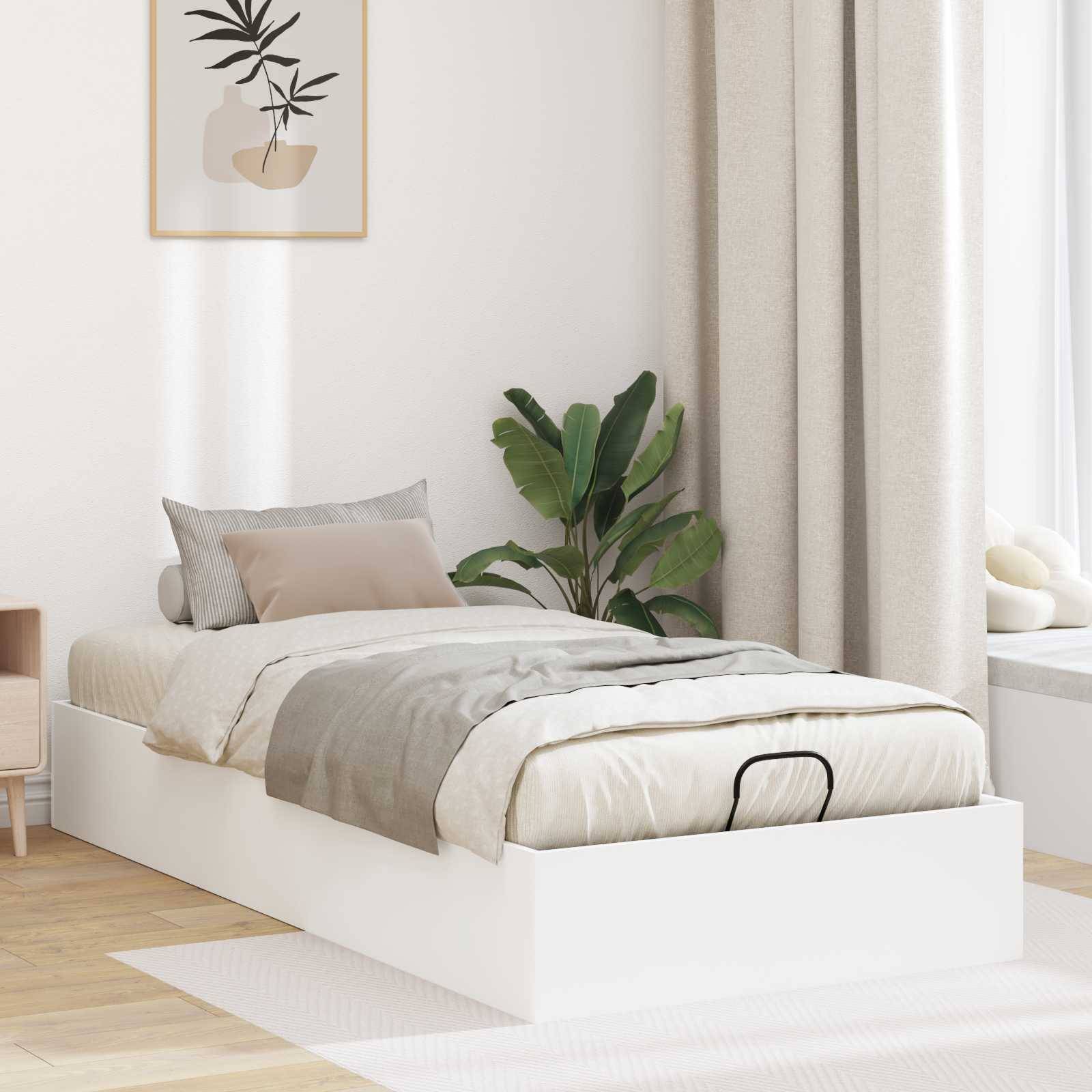 Ein minimalistisches Schlafzimmer verfügt über ein weißes Bett mit beigefarbener Bettwäsche, eine Topfpflanze und ein gerahmtes abstraktes Kunstwerk an der Wand.