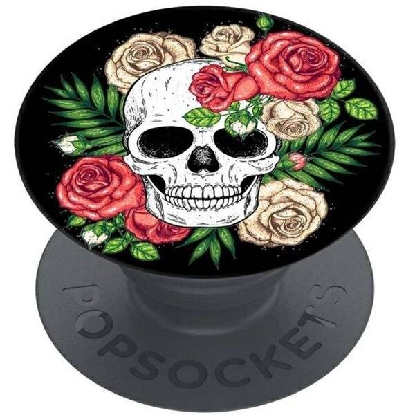 Ein dekoratives PopSocket mit einem weißen Schädel, umgeben von roten und beigen Rosen mit grünen Blättern auf schwarzem Hintergrund.