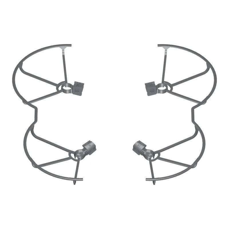 Zwei kreisförmige Metallrahmengitter mit Querstreben, jeweils mit einer Klemmvorrichtung. Symmetrisch angeordnet, möglicherweise Schutzgitter.