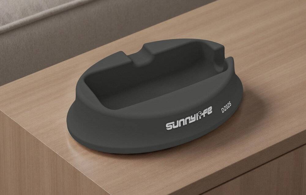 Ein schwarzer Kunststoff-Gerätehalter mit der Bezeichnung „Sunnylife DZ203