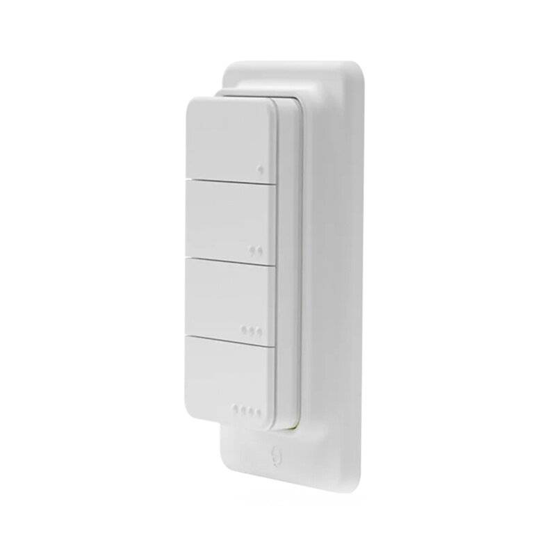 Ein weiß an der Wand montierter kabelloser Lichtschalter mit vier Tasten, jede mit drei kleinen Punkten gekennzeichnet.