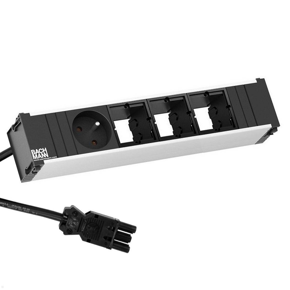 Bachmann-Steckdosenleiste mit einer europäischen Steckdose, drei leeren Steckplätzen und schwarzem Kabel, verwendet für elektrische Verbindungen.