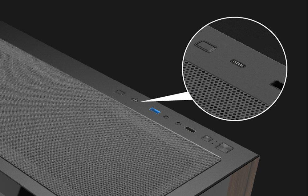 Nahaufnahme des oberen Bedienfelds eines Lautsprechers mit einem Netzschalter, einem USB-C-Anschluss und einer Netzoberfläche, die das Design des Lautsprechers anzeigt.