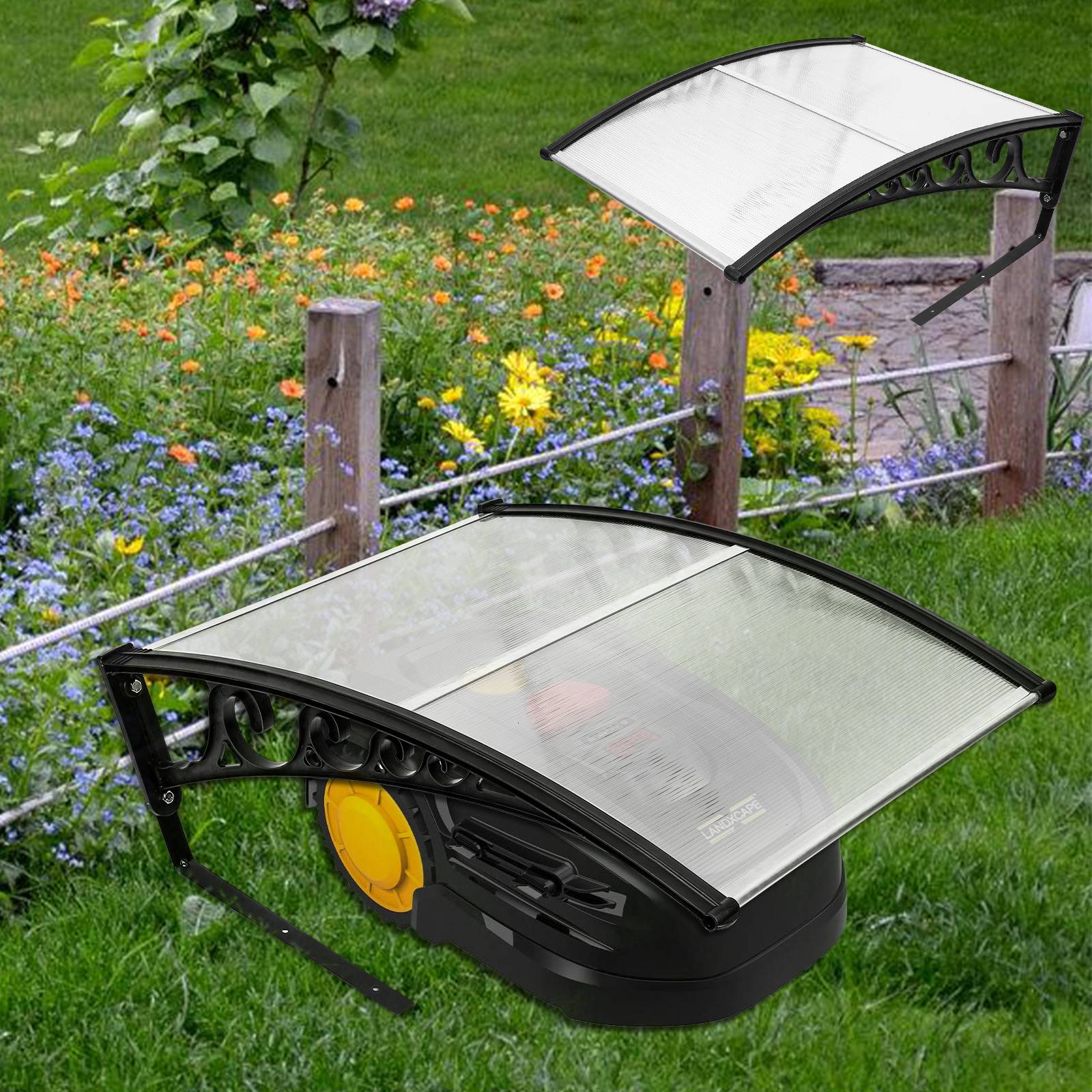 Ein Rasenroboter lädt unter einer transparenten Schutzhaube in der Nähe eines Blumengartens mit orangefarbenen und blauen Blüten auf.