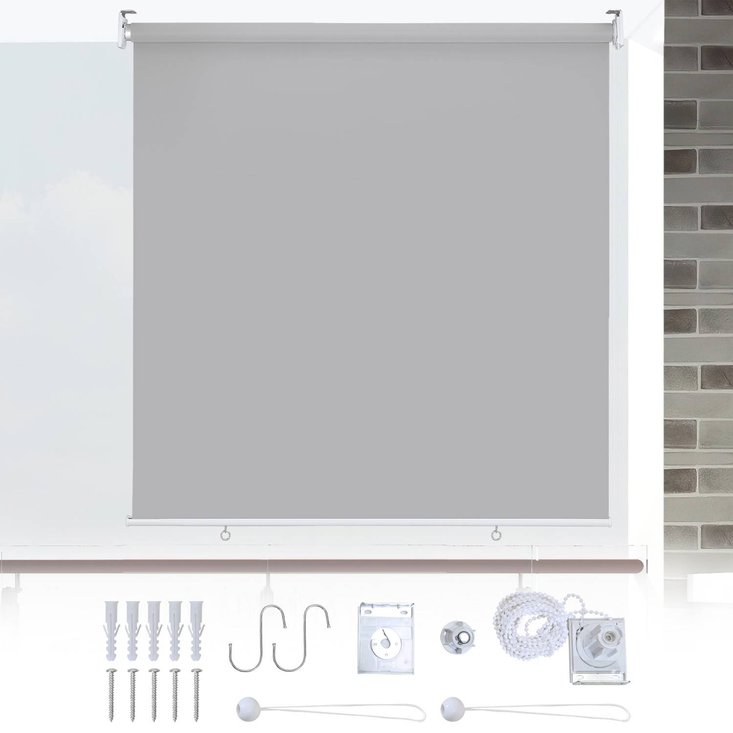 Eine graue Rollostoffe mit Montagehardware und Installationszubehör, die von vorne angezeigt wird, vor einer Wand mit Ziegelbelegung.