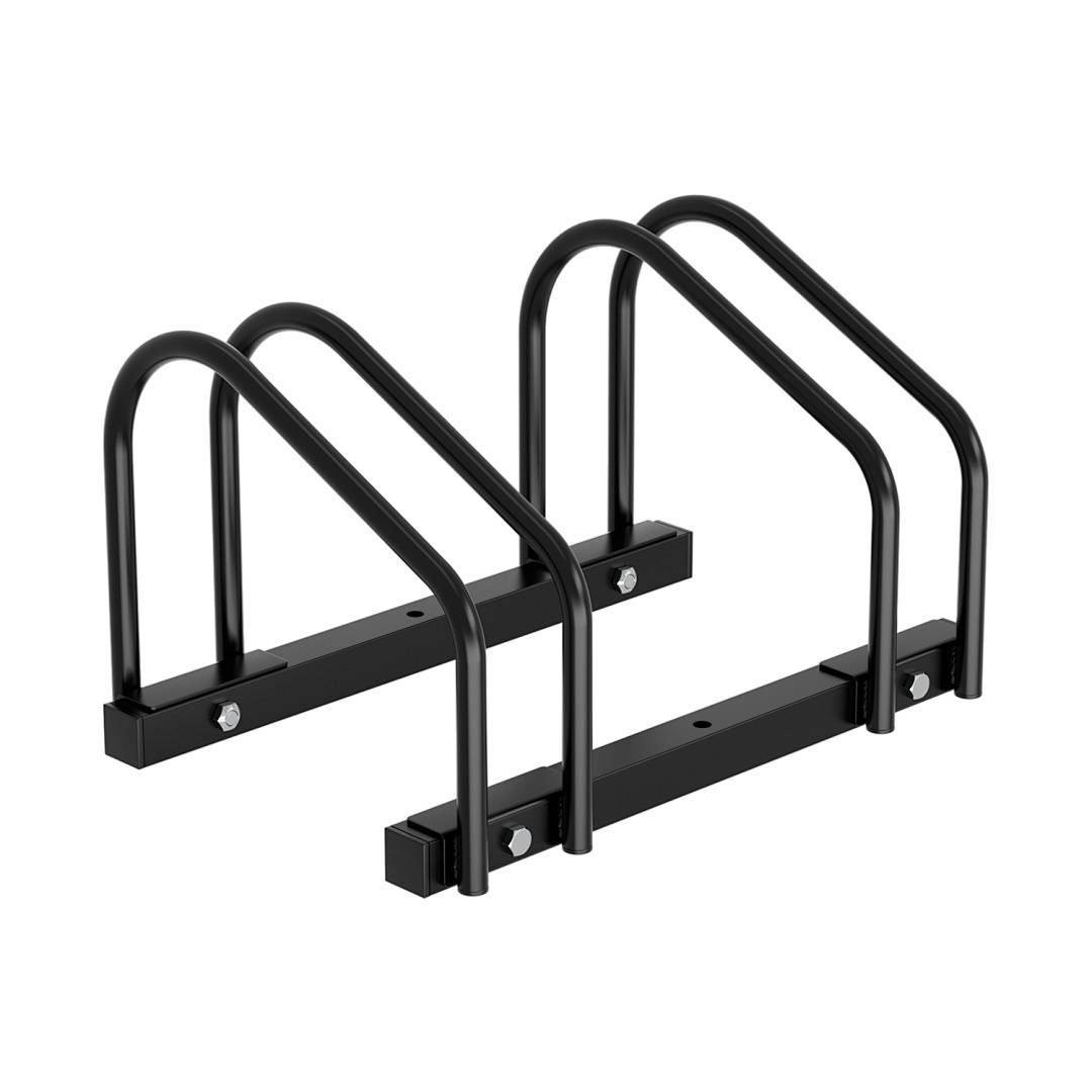 Ein schwarzes Metallfahrradständer mit bogenförmigen Schleifen, das zum sicheren Halten von zwei Fahrrädern auf dem Boden konzipiert ist.