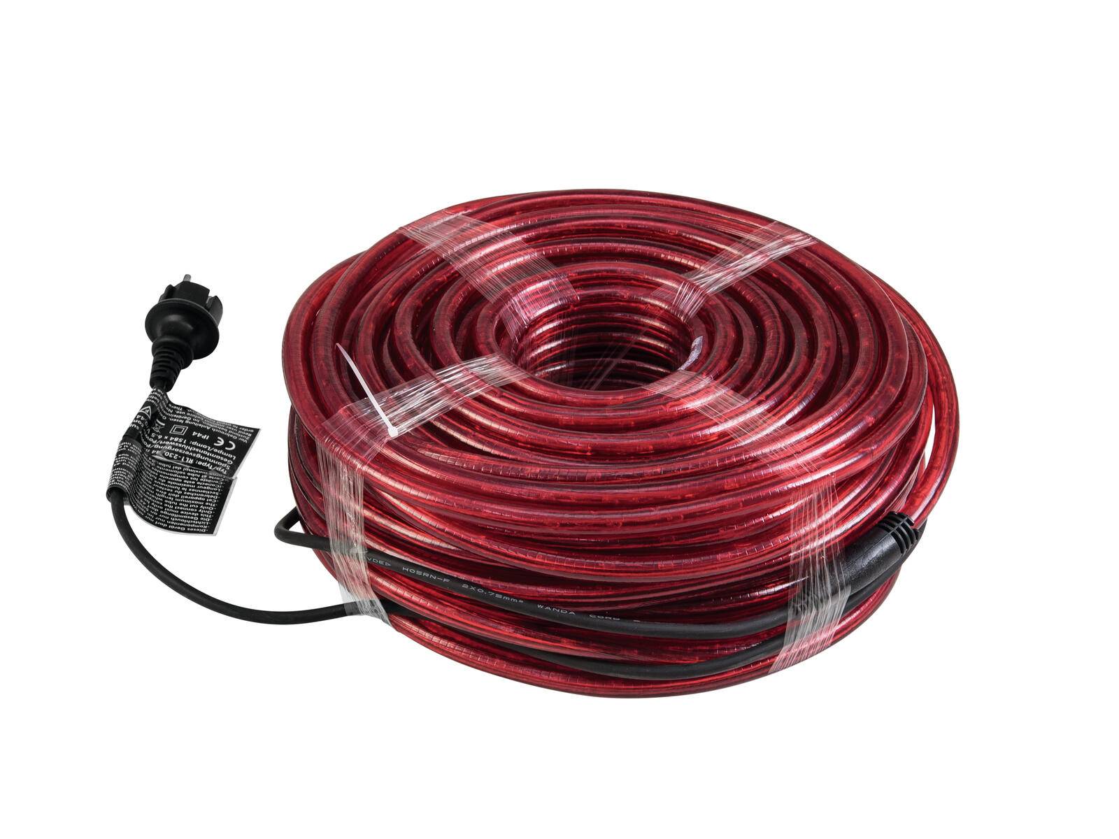 Ein aufgerolltes rot-schwarzes elektrisches Heizungskabel mit Stecker, in transparente Kunststofffolie eingewickelt.