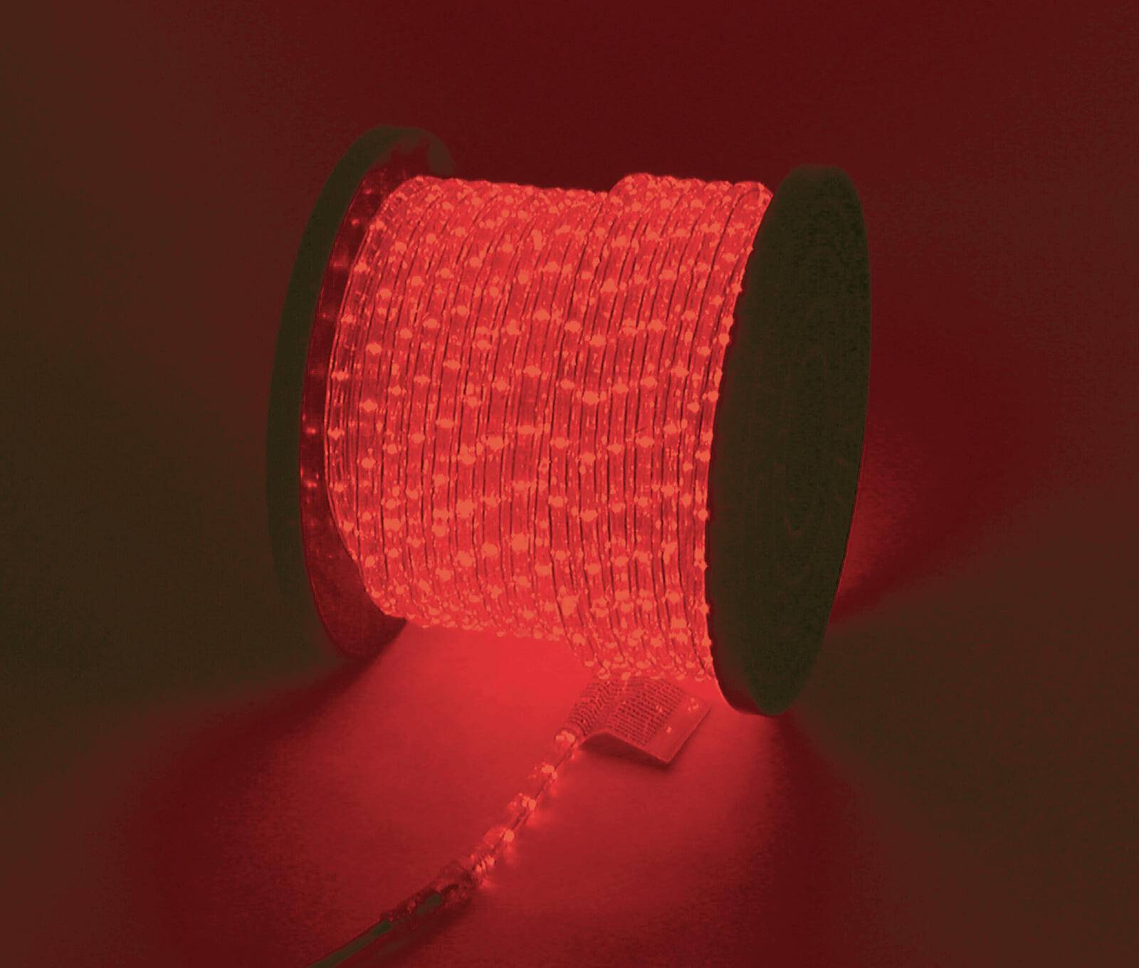 Eine Spule mit roten LED-Streifenleuchten leuchtet und erleuchtet die umgebende Fläche mit einem warmen roten Farbton.