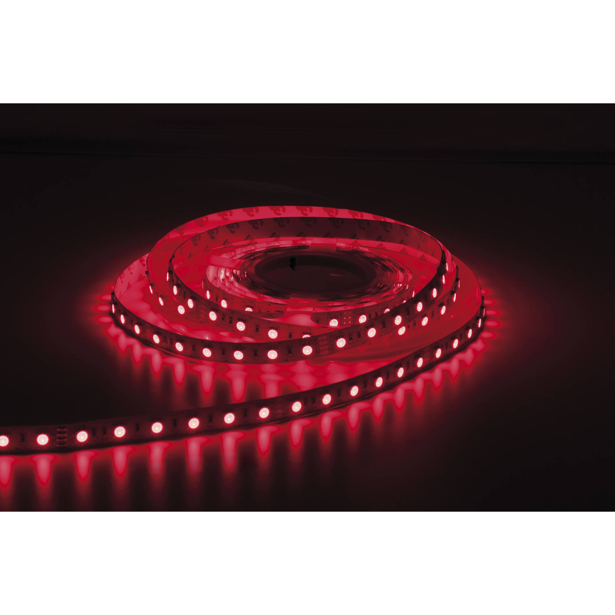 „Rote LED-Streifen in einer Spirale auf einer dunklen Oberfläche angeordnet, die einen warmen roten Glanz ausstrahlen.