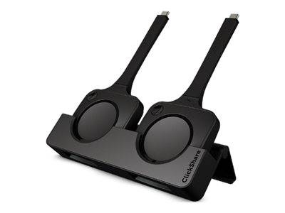 Zwei schwarze ClickShare Wireless-Präsentationstasten auf einem Ständer, verwendet zum Verbinden von Laptops mit einem Anzeigebildschirm in Besprechungsräumen.