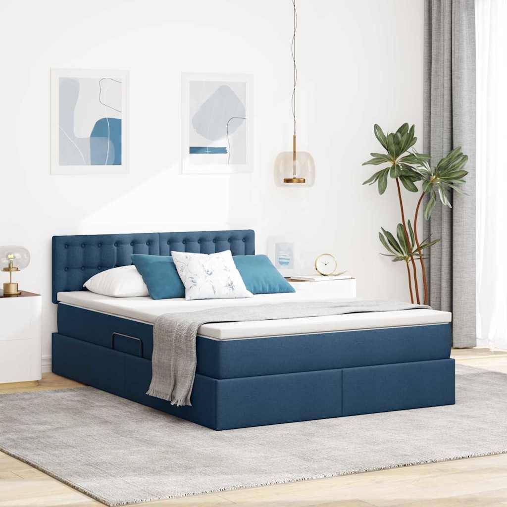 Ein modernes Schlafzimmer mit einem blau gepolsterten Bett, weißer Bettwäsche, blau-weißen Kissen und Wandkunst. Eine Pflanze und eine Lampe vervollständigen die Einrichtung.