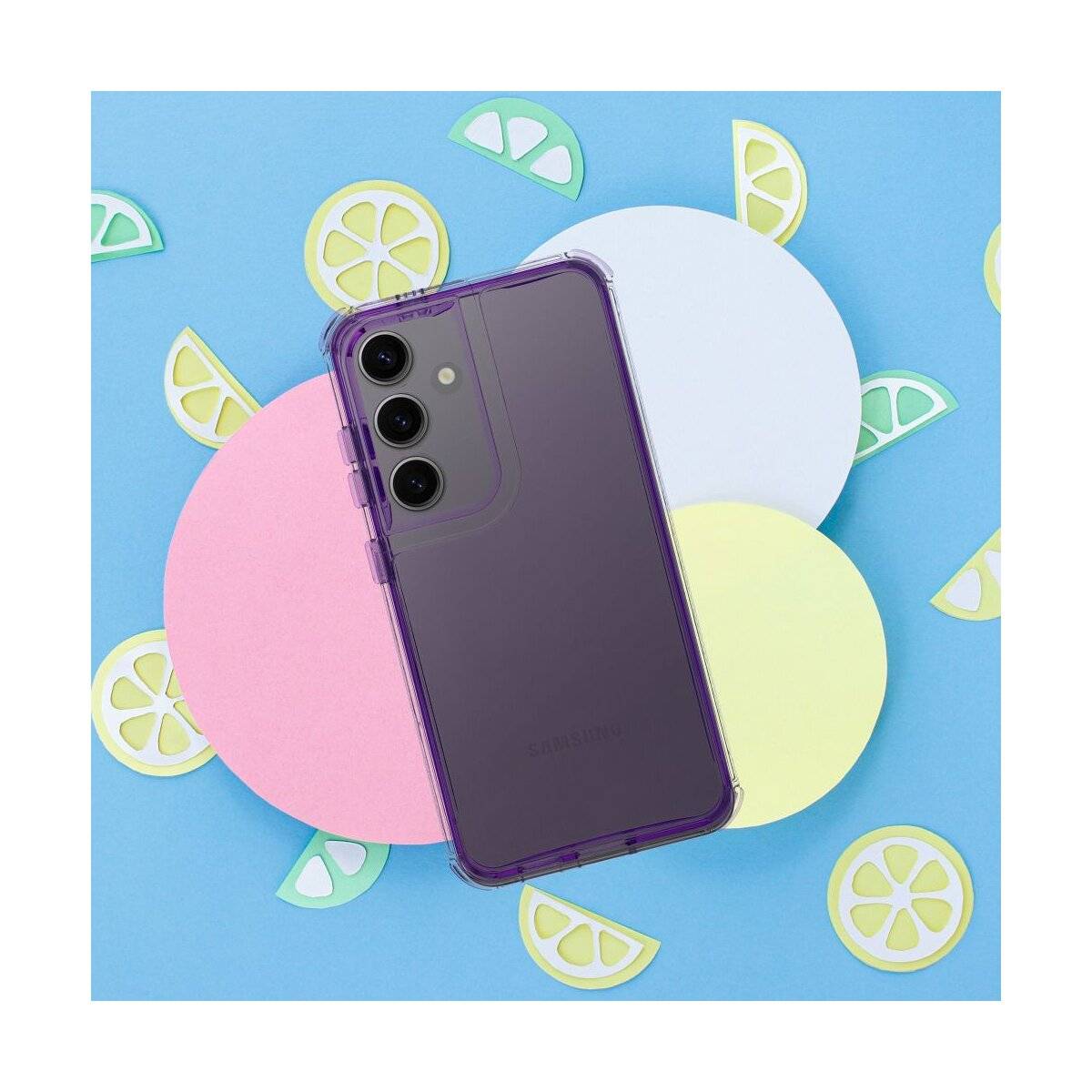Ein lila Smartphone mit drei Rückfahrkameras auf einem farbenfrohen Hintergrund aus überlappenden Pastellkreisen und Zitronenscheiben-Grafiken.