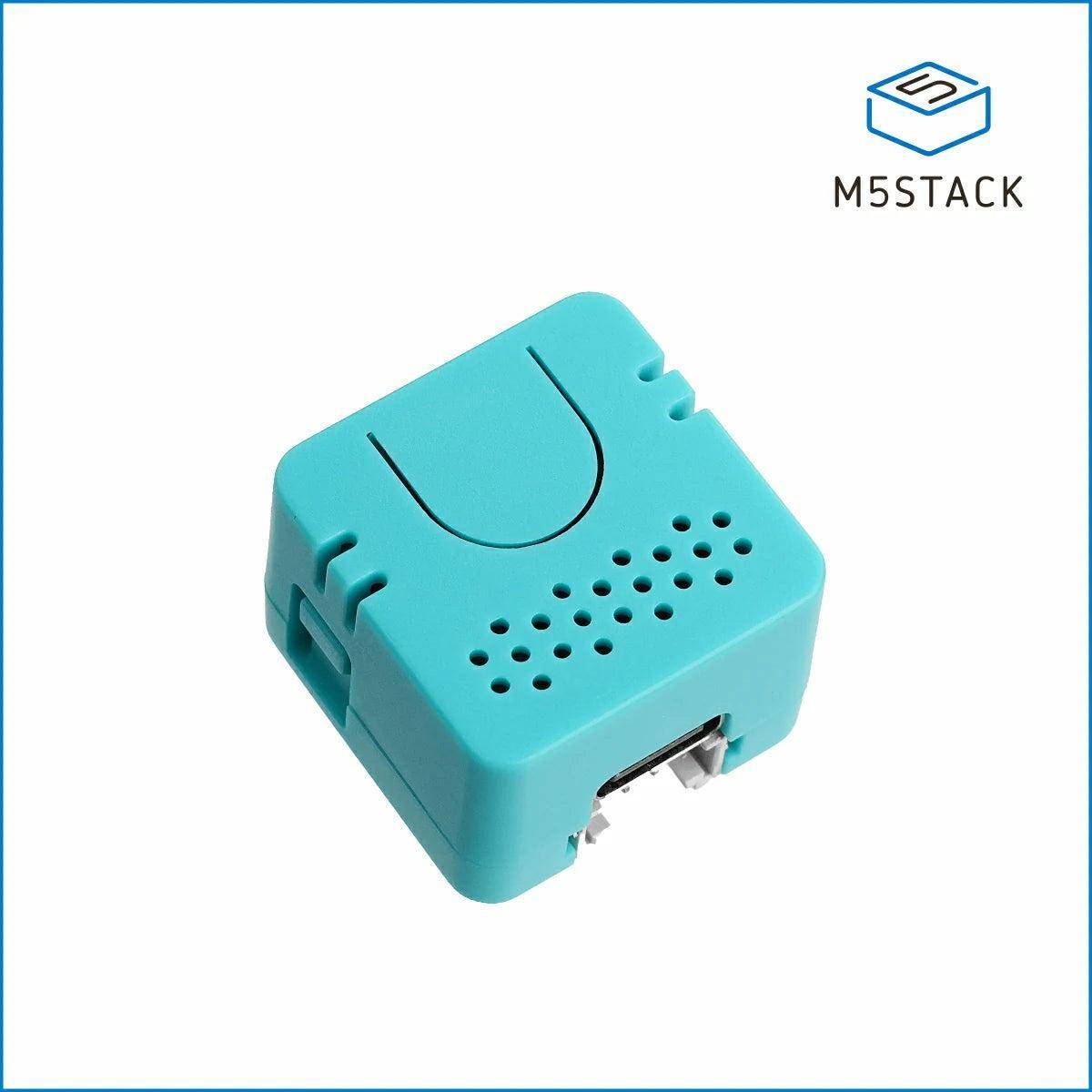 Eine türkisfarbene M5Stack-Umweltsensoreinheit mit kompaktem Design und Belüftungslöchern, die zur Messung von Temperatur und Luftfeuchtigkeit verwendet wird.